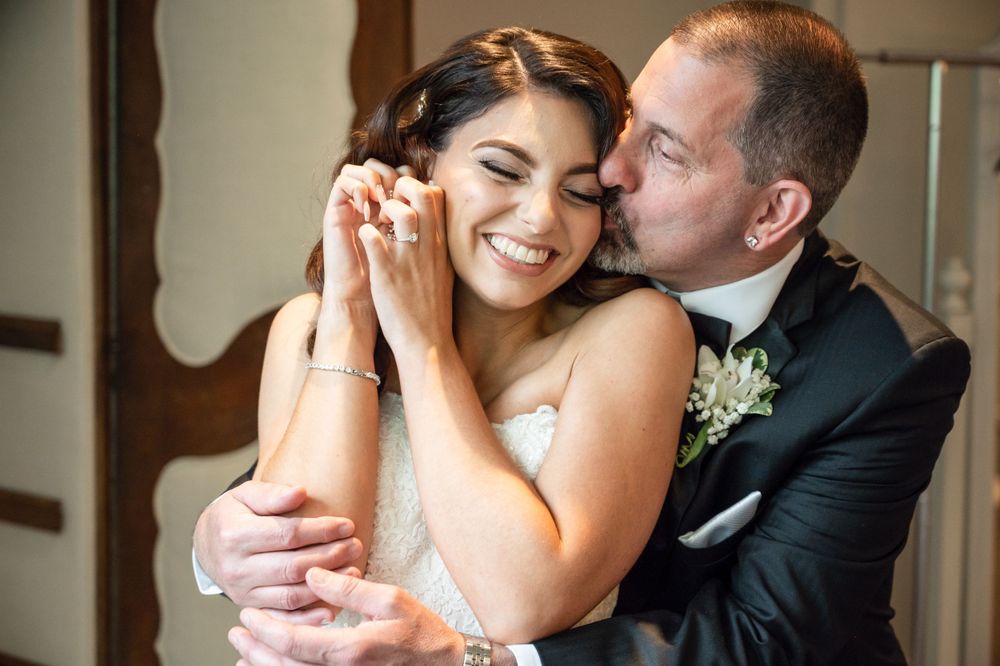Close-up romantic shots of a couple sharing tender moments during their wedding celebration.