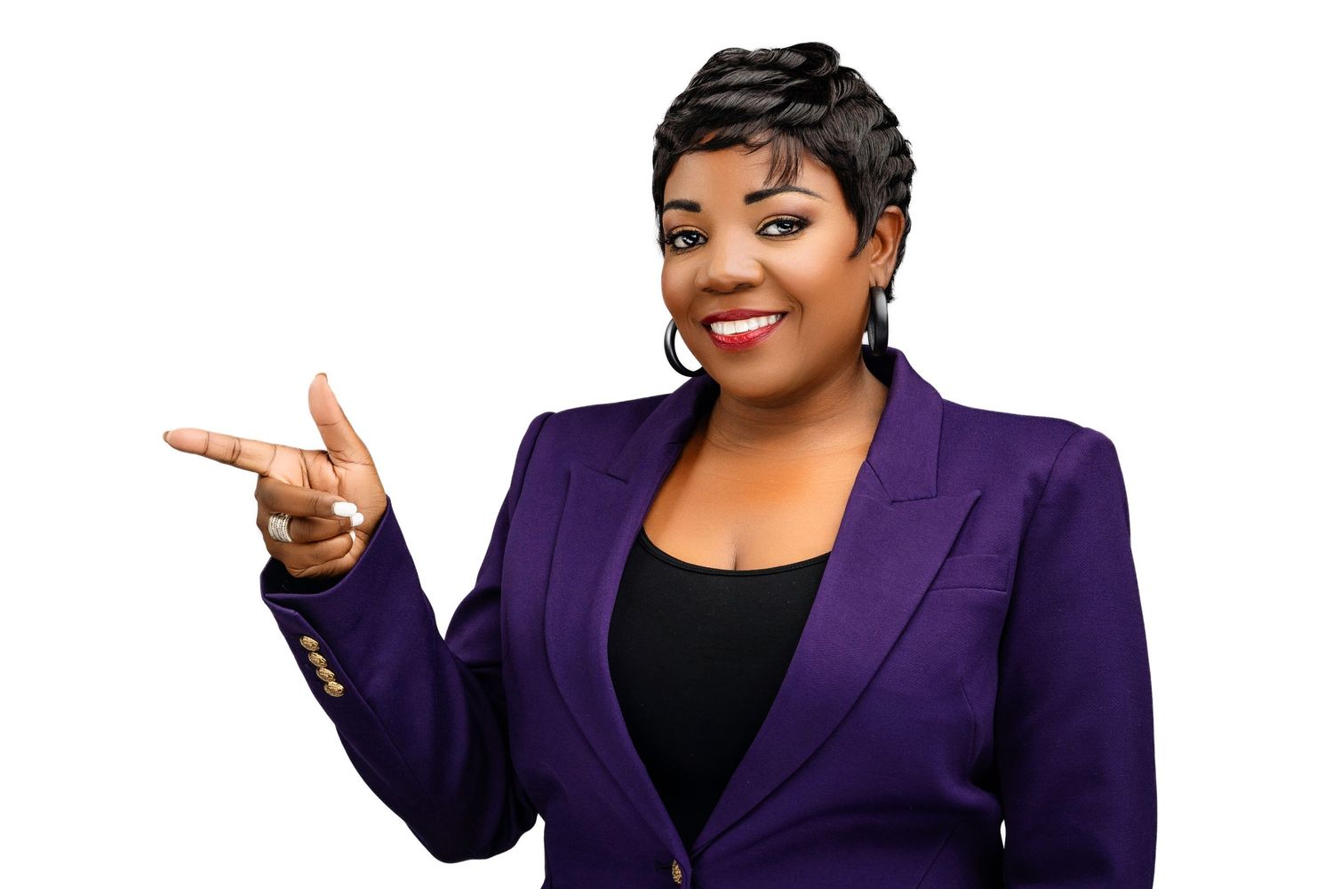 Confident woman in purple blazer smiling and gesturing on white background.