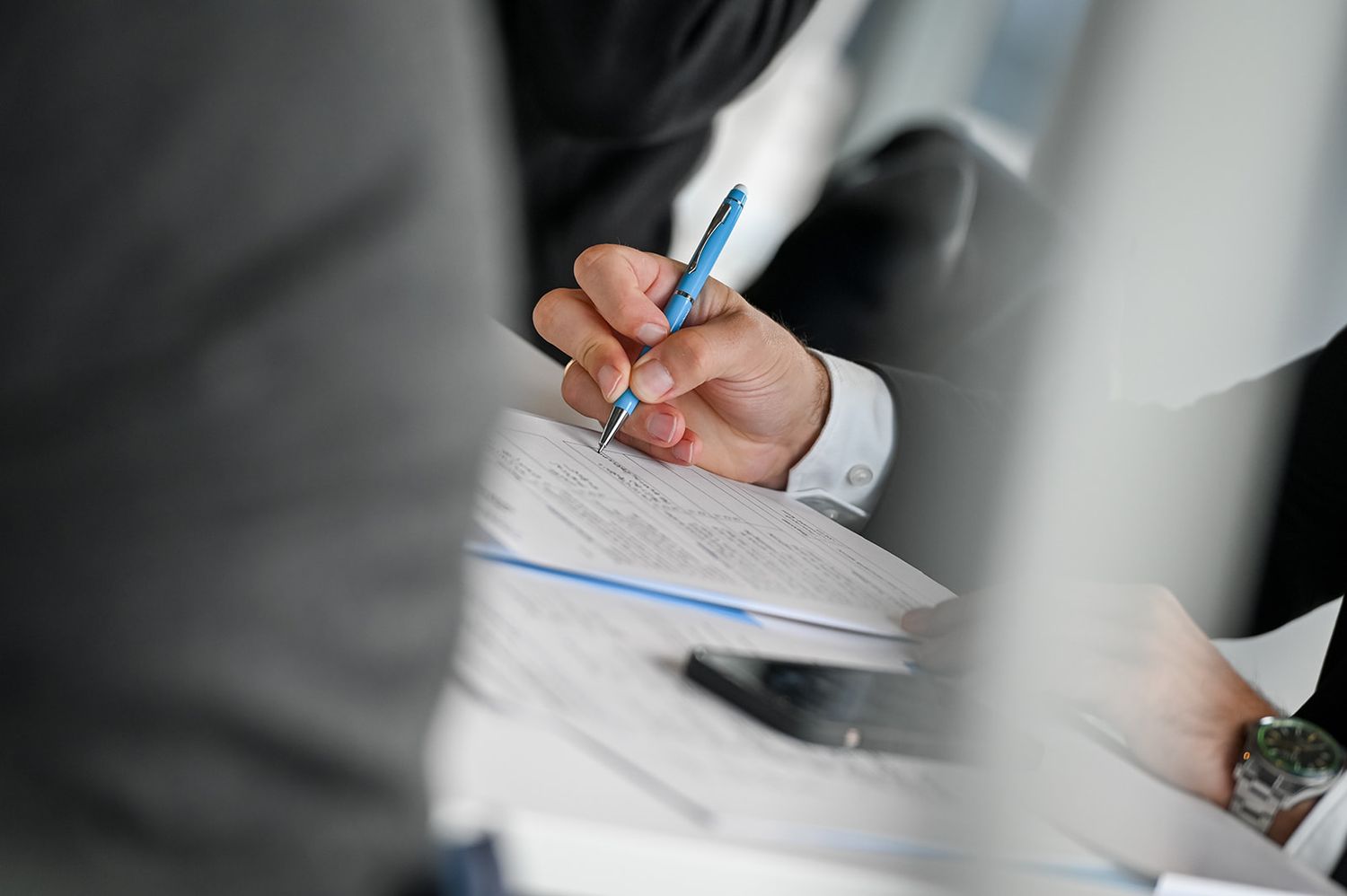 man writing close up of hand  | HIGHER EDUCATION PHOTOGRAPHER, UNIVERSITY PHOTOGRAPHER, COMMERCIAL PHOTOGRAPHER