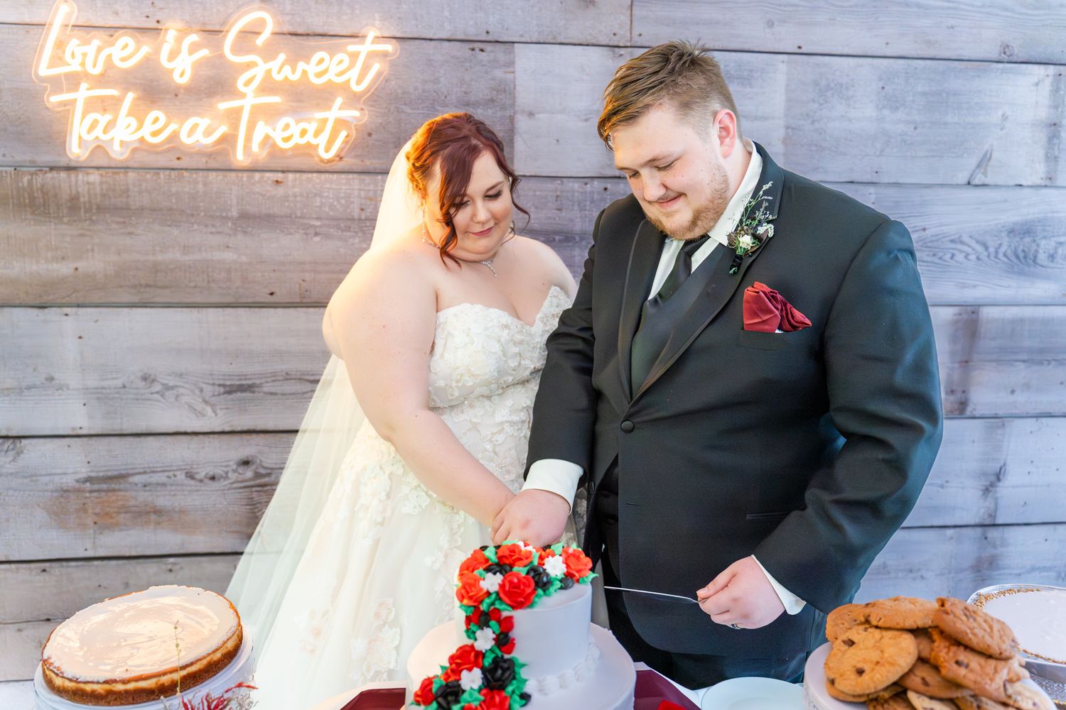 bride and groom cut the cake