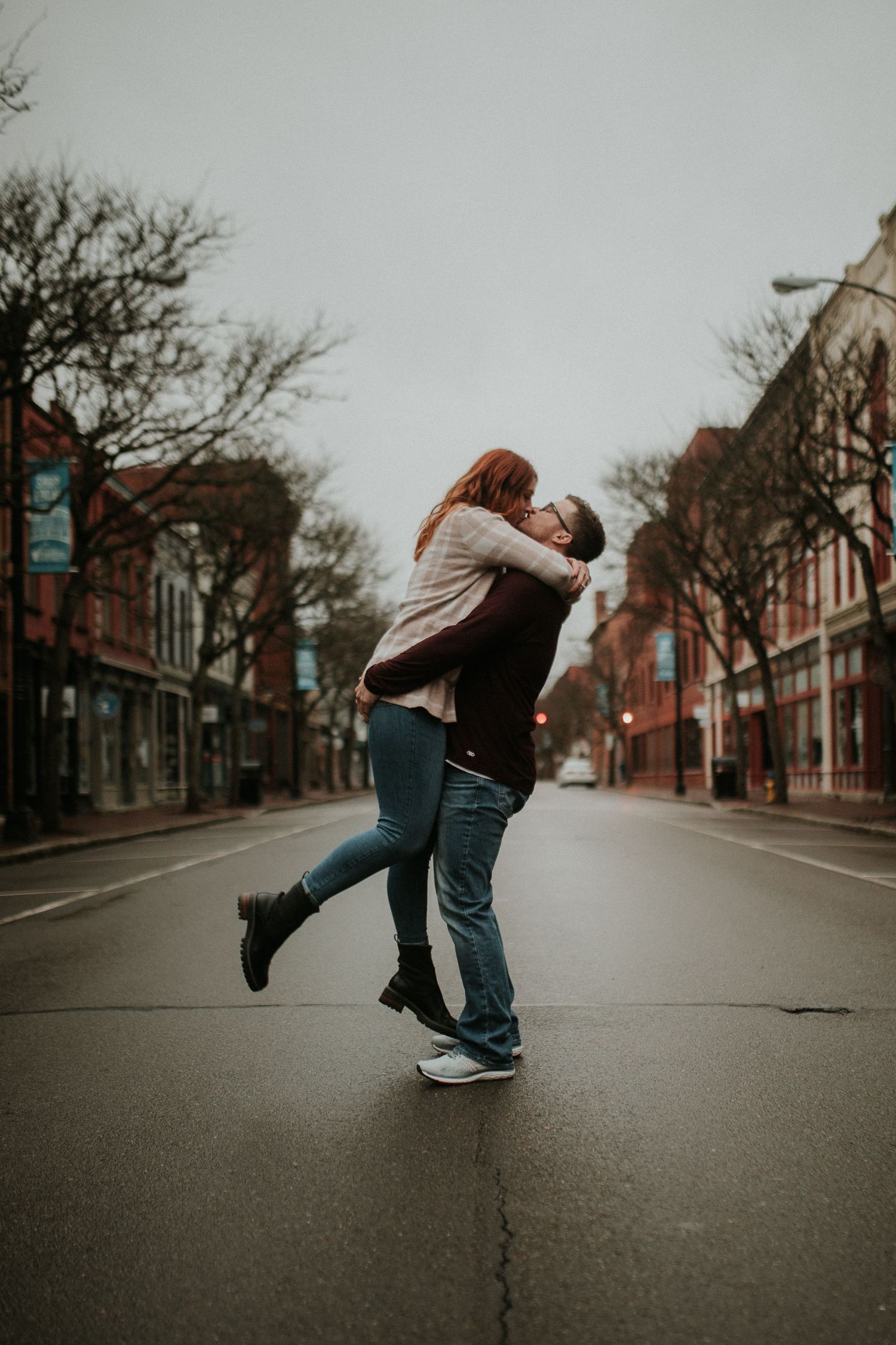 couple kissing in the middle of market street in corning ny