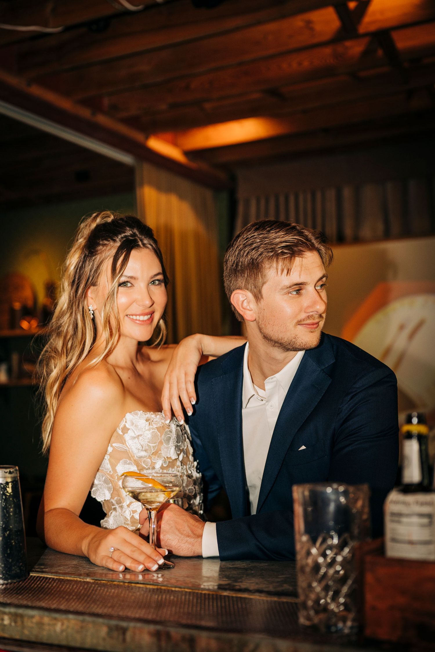 Newly Engaged couple in Sarasota, FL posing at State Street Eating House + Cocktails during their flash photography.