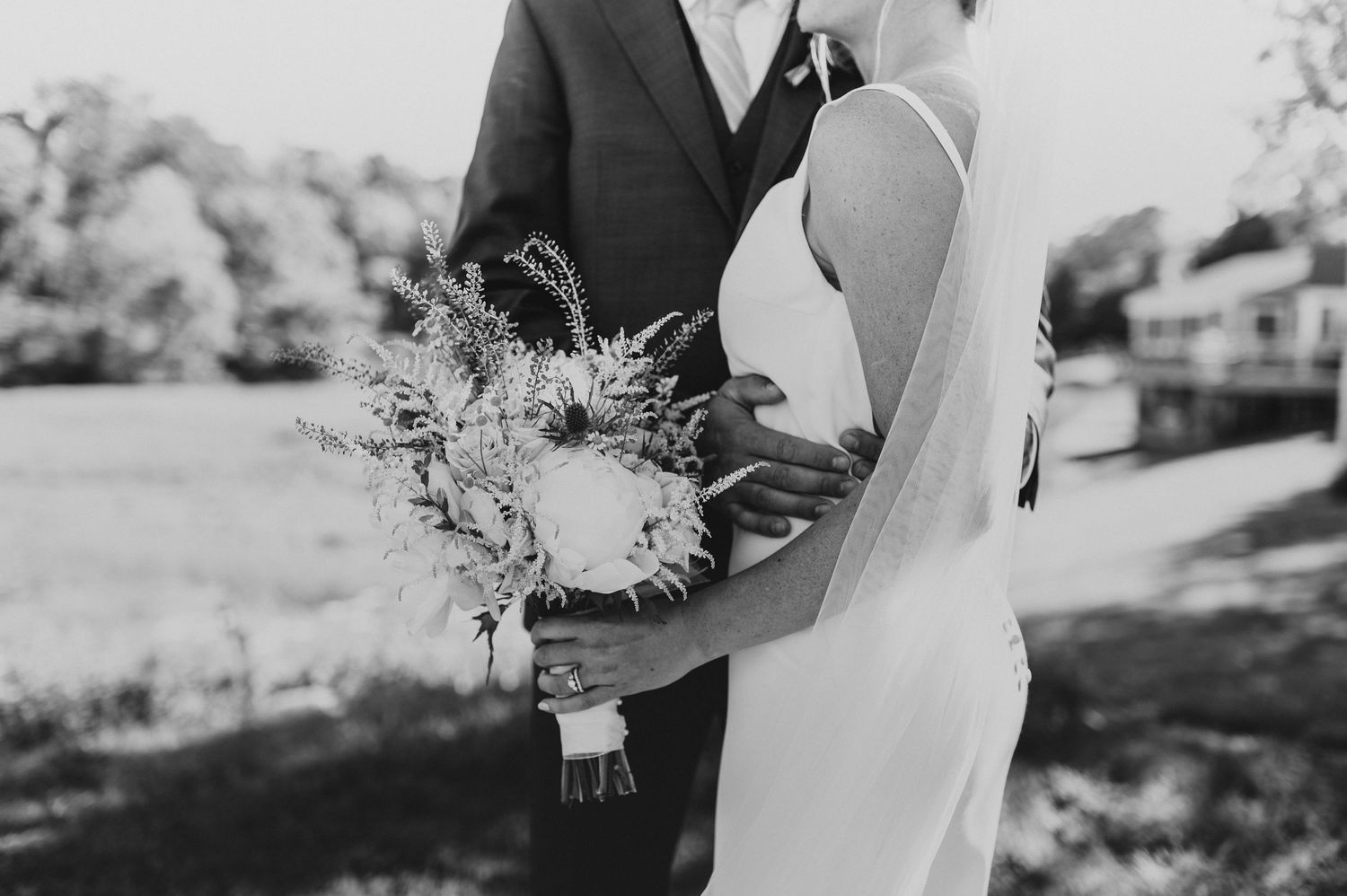 Black and white wedding portraits showcase elegant bridal details.