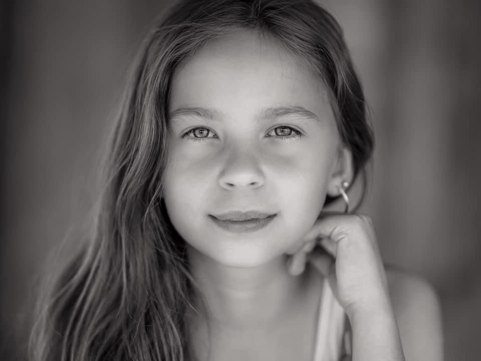 Close-up portrait series showing different expressions in black and white.