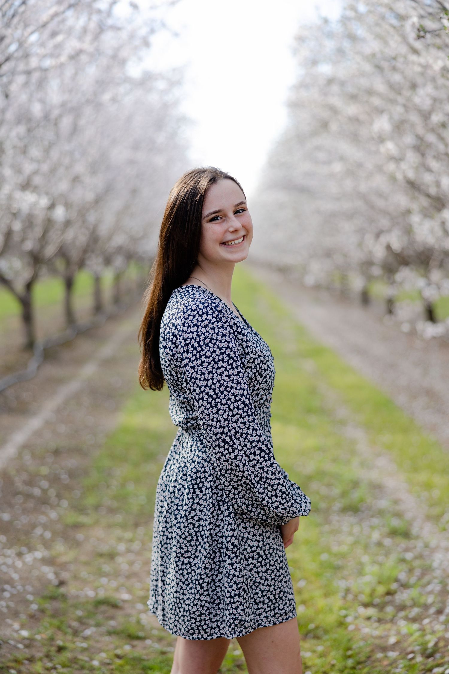 Senior Portrait in Blooming Almond Orchard in Orland, California, Northern California