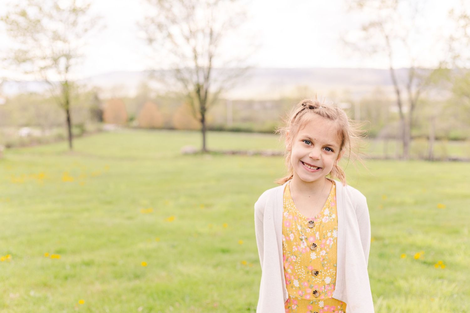 Portrait of a girl with mountains in the background during a photo session with Danielle Lauren Photography