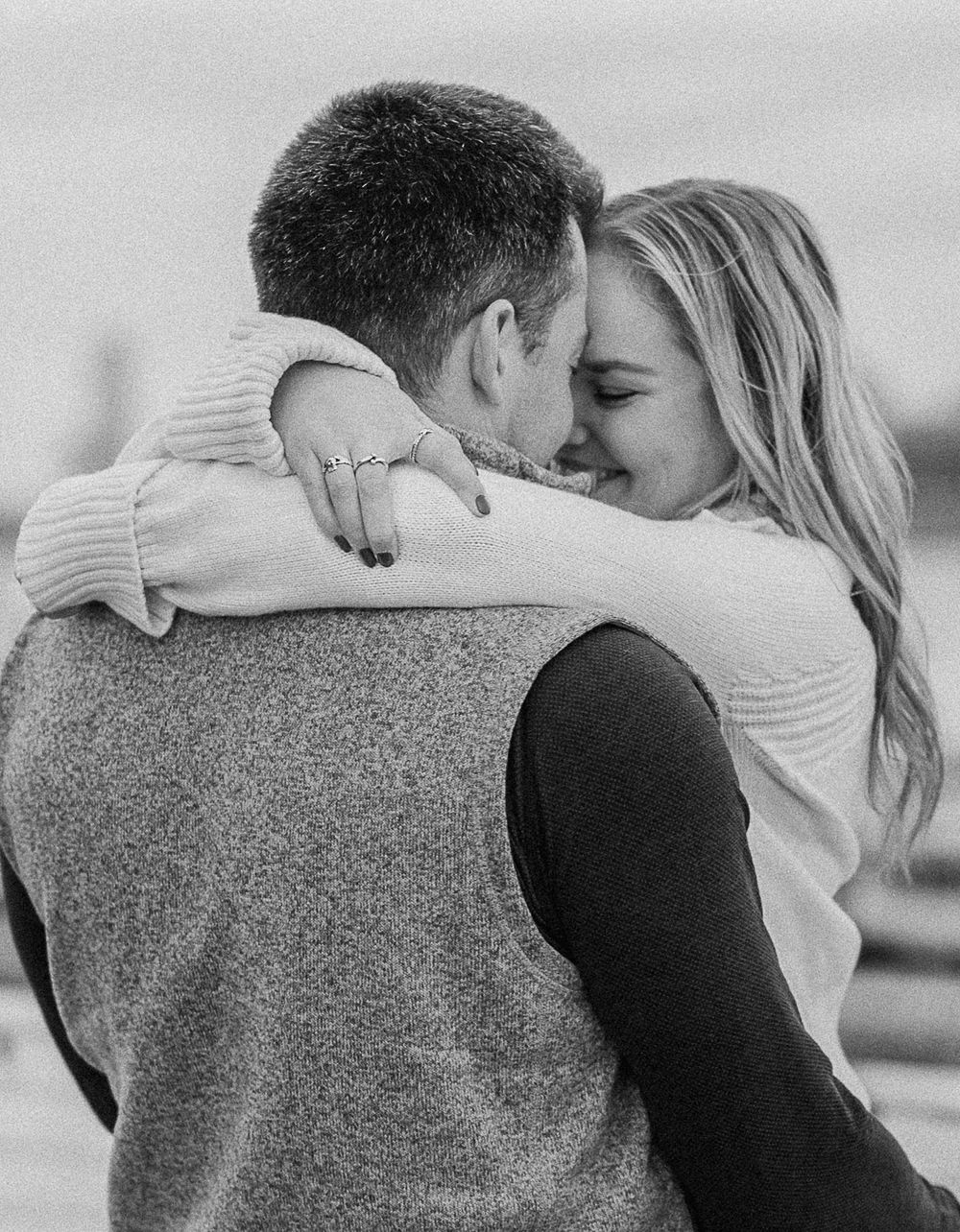 Black and white series showing tender embraces between a couple.