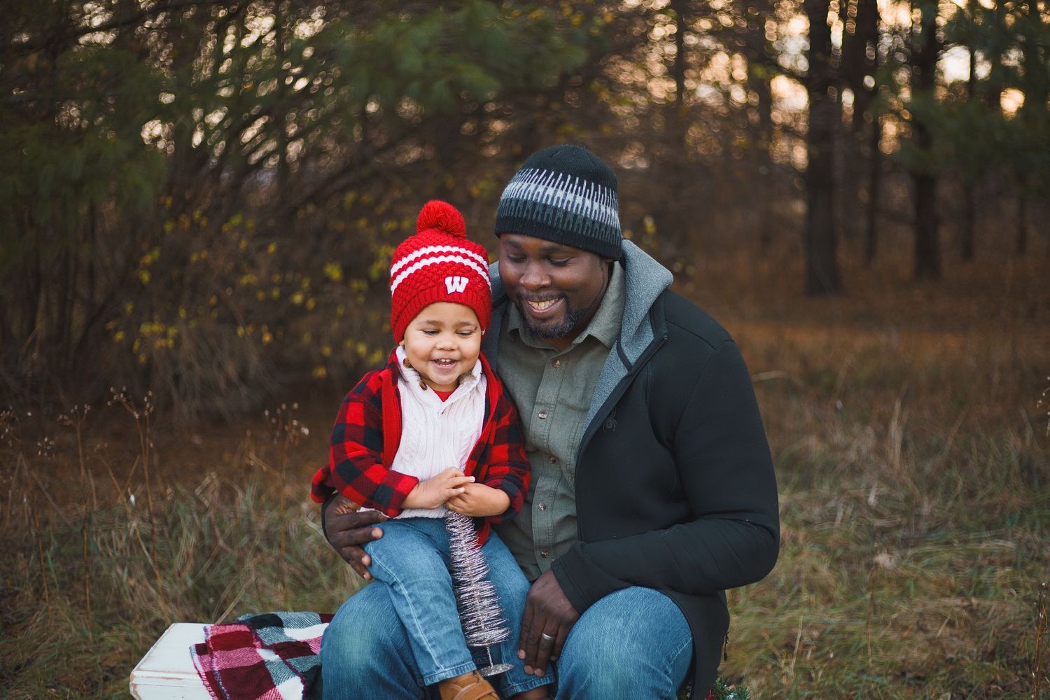 token creek county park deforest madison wi family photography christmas mini session father and son smiling on bench
