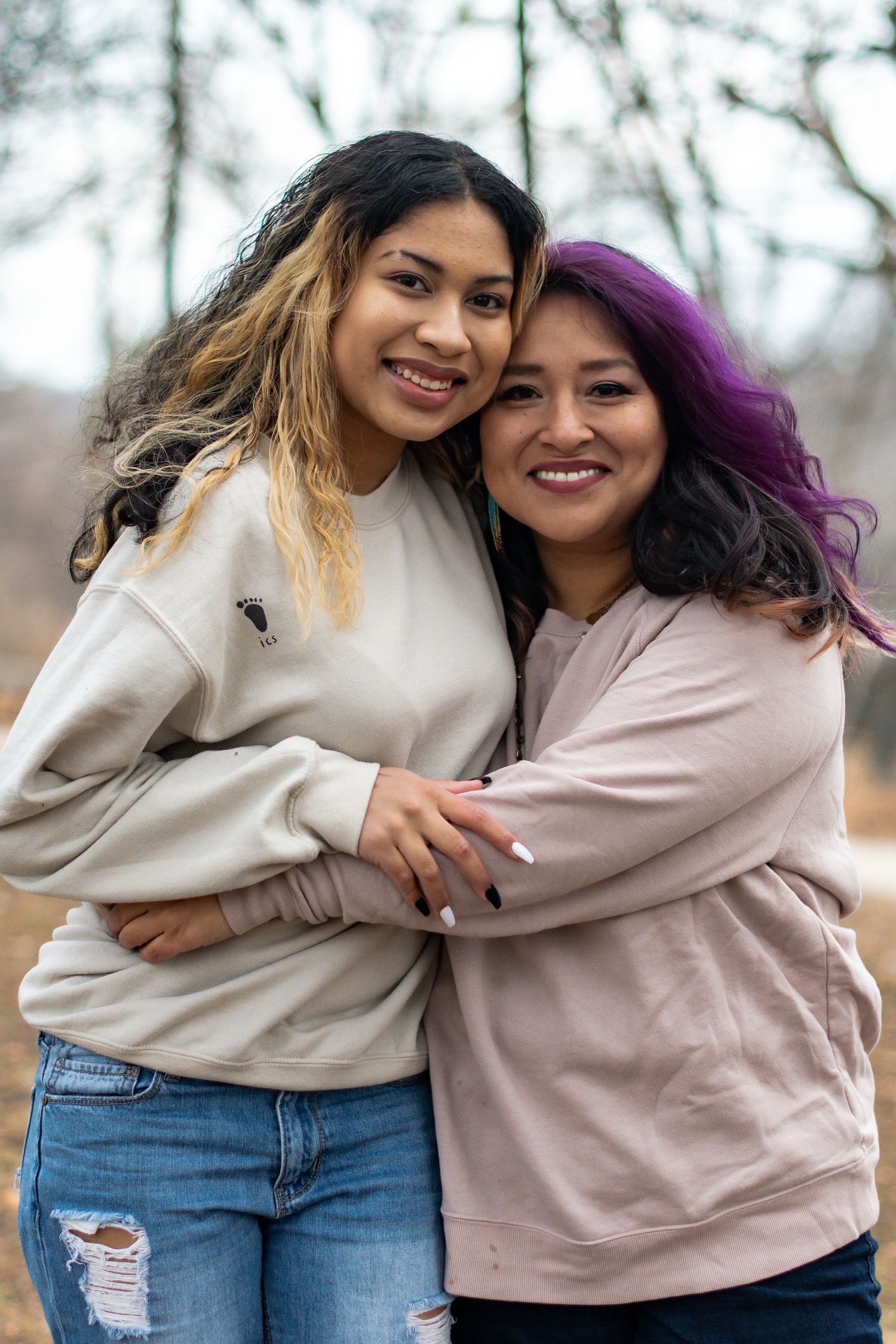 Sweet candid portrait series showing two people embracing and laughing together outdoors.