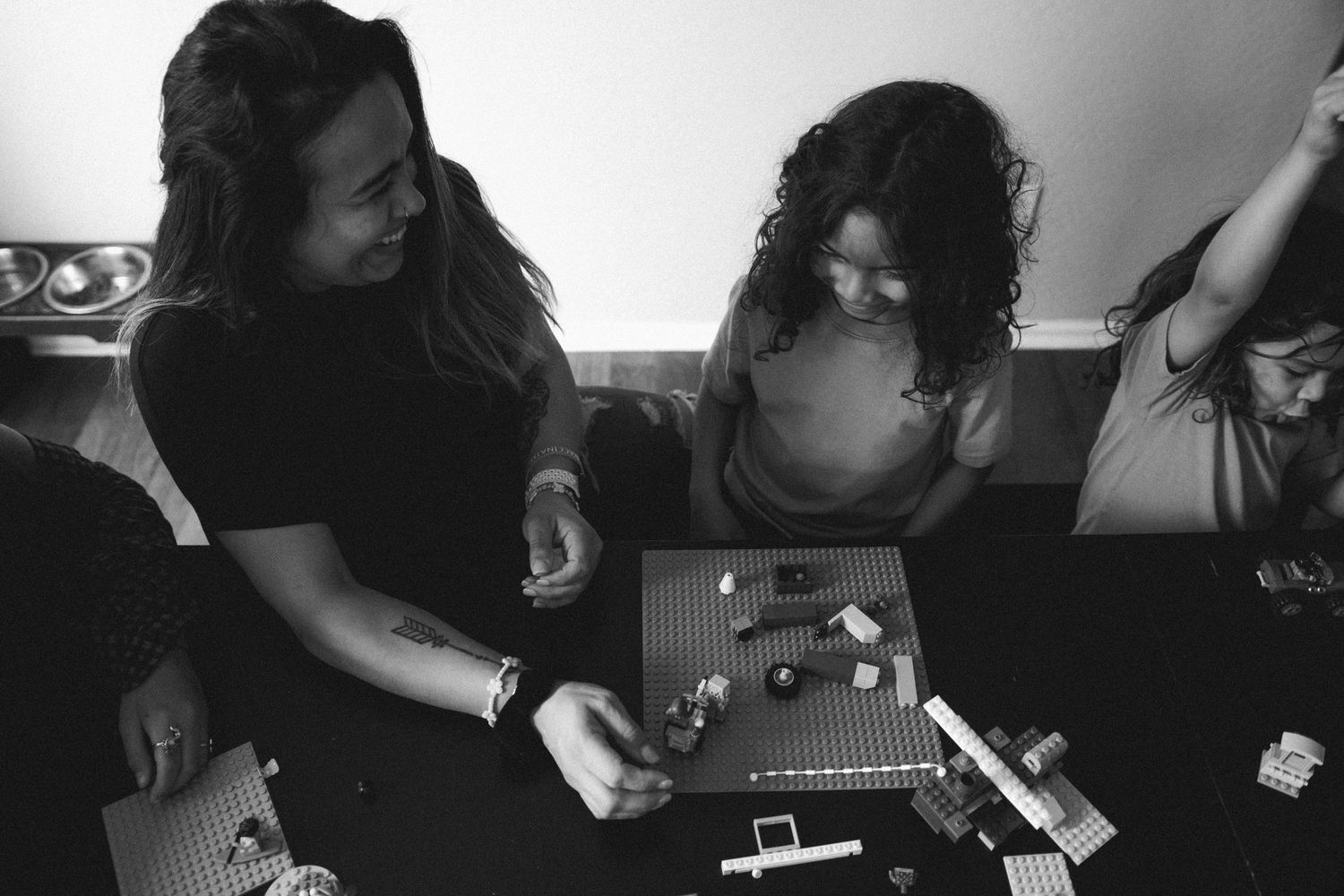 A mom and her kids playing with legos in their home in Gilbert, AZ