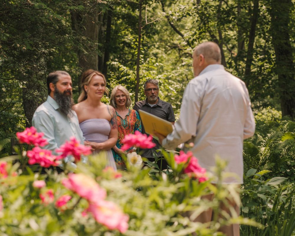 Intimate wedding ceremony in flower garden