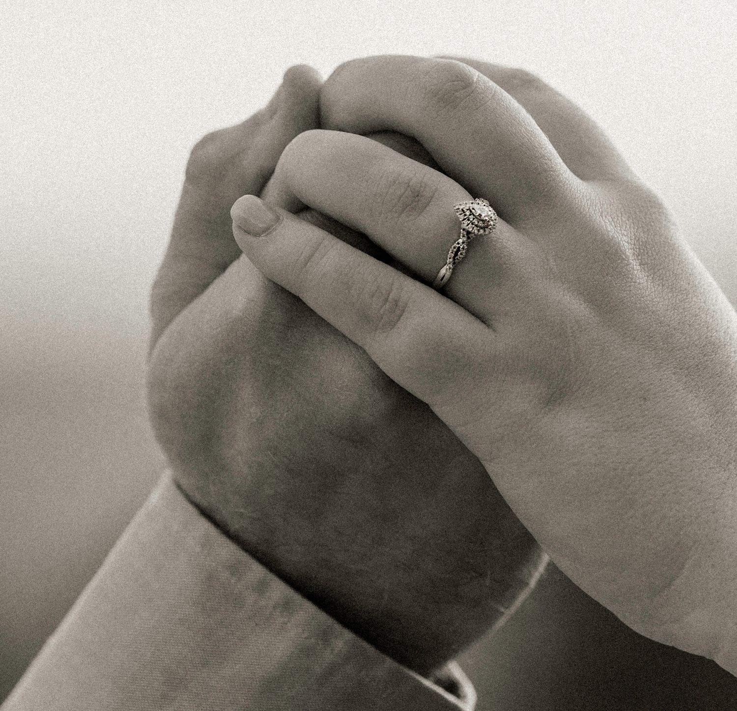 Series of black and white photos showing hands with engagement ring in different poses.