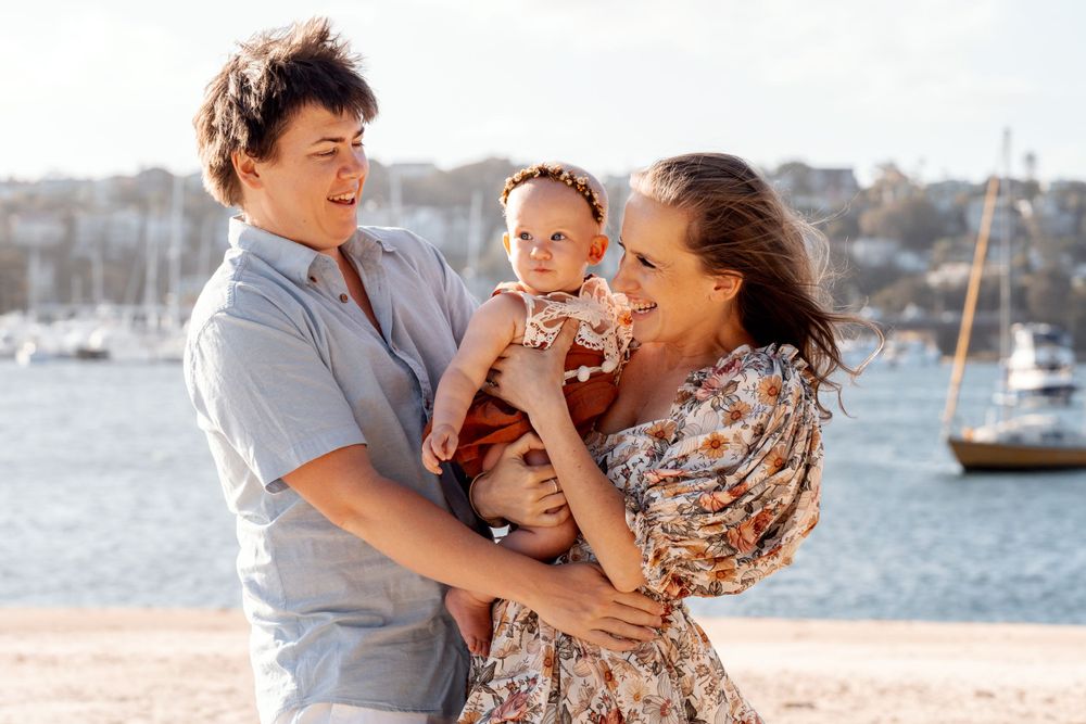 happy moment of parents during a family photoshoot at the Clontarf beach