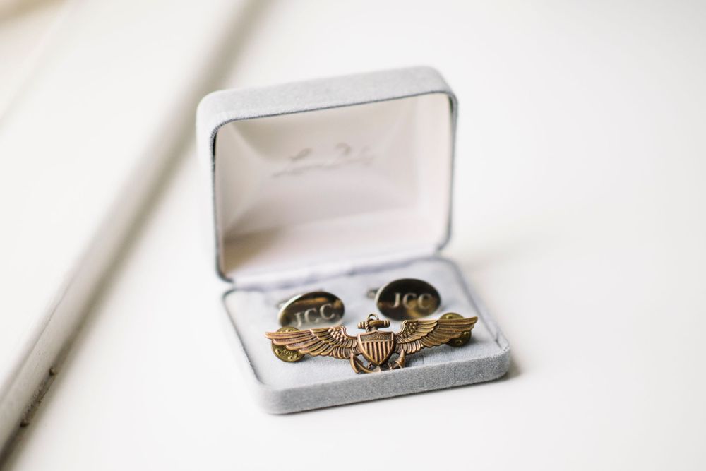 Wedding rings with unique designs displayed in a white ring box.