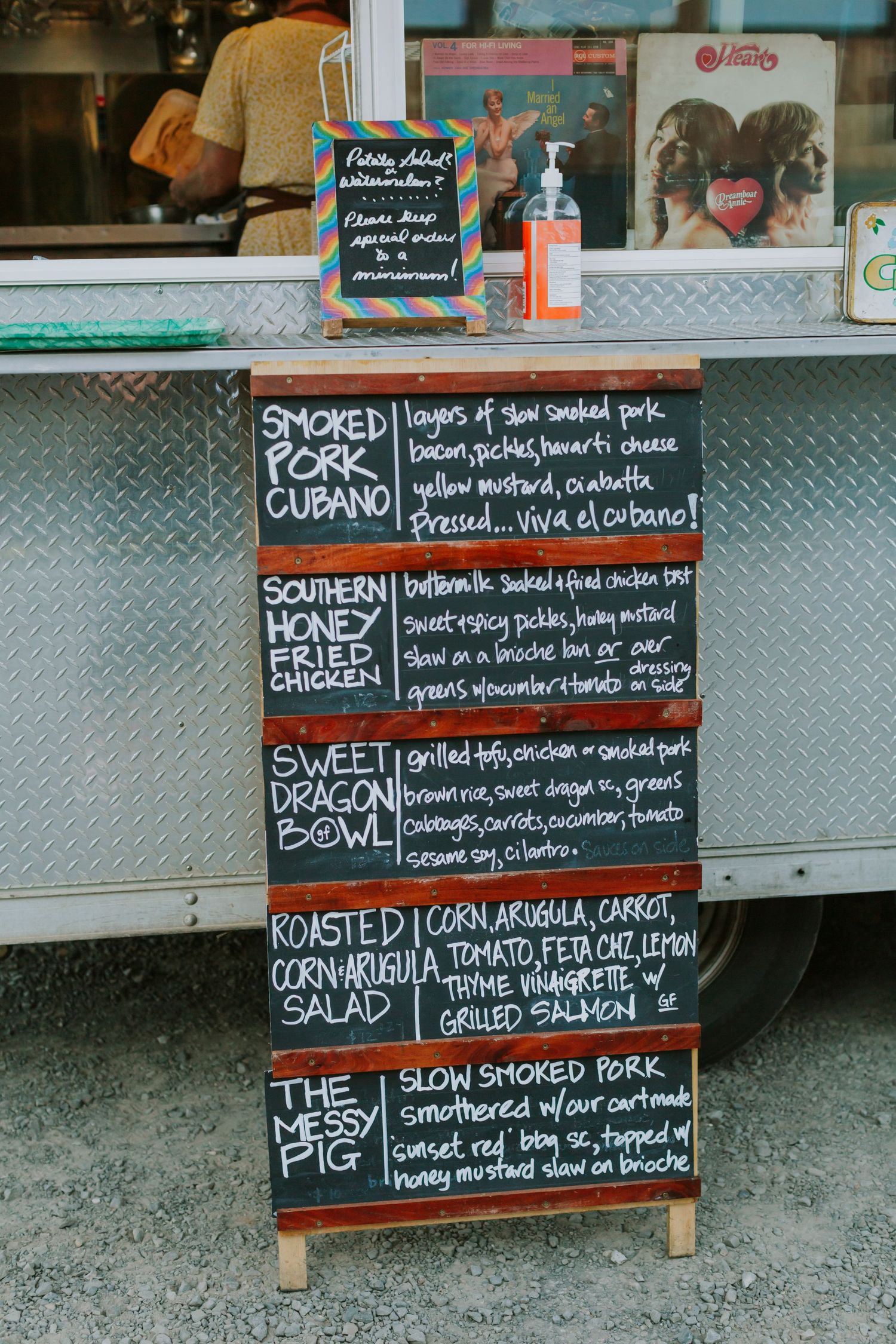 Food truck menu with descriptive options written in chalk on blackboard