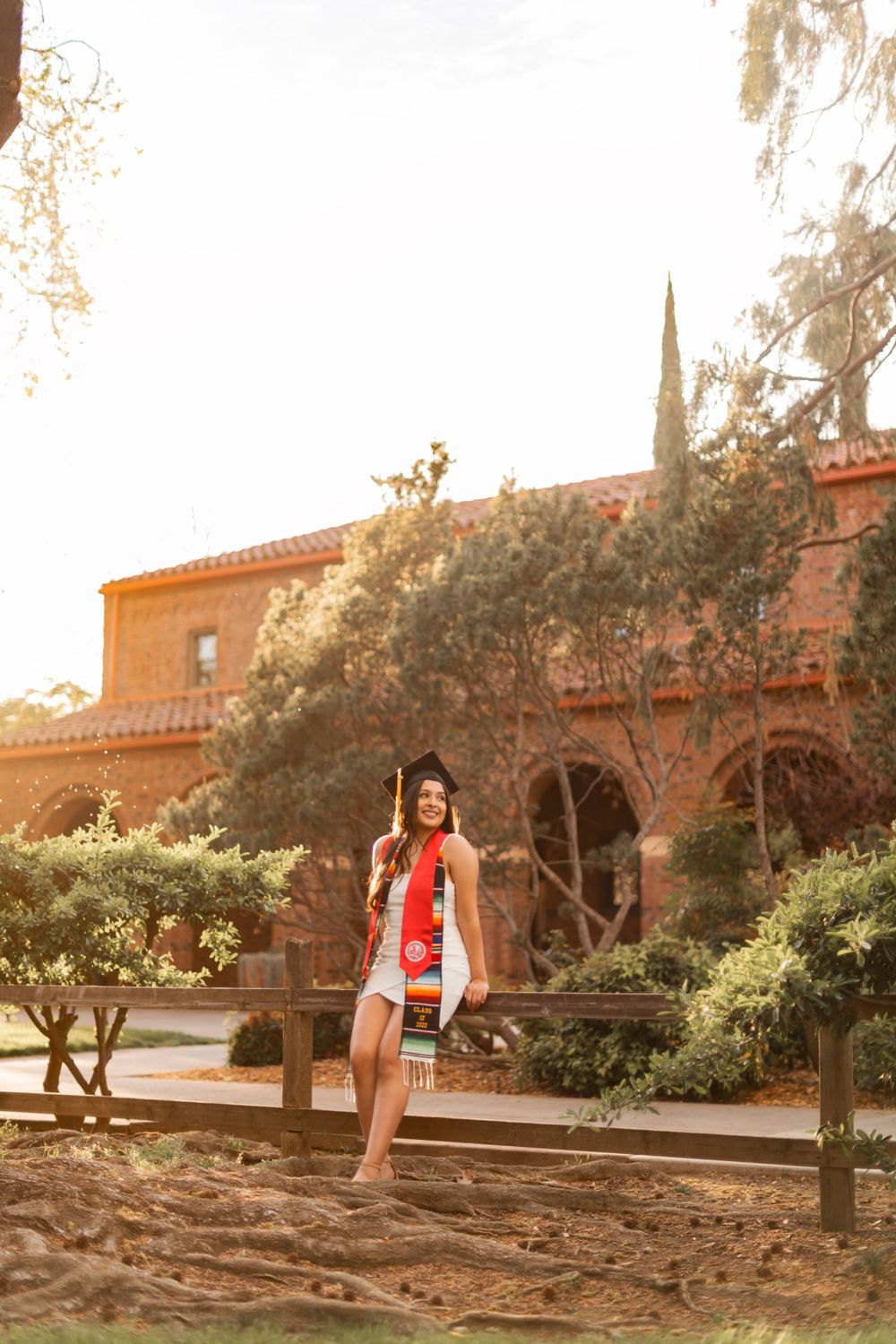 girl posing in a college graduation portrait taken at Chico State University Photographed by Shumesa Mohsin