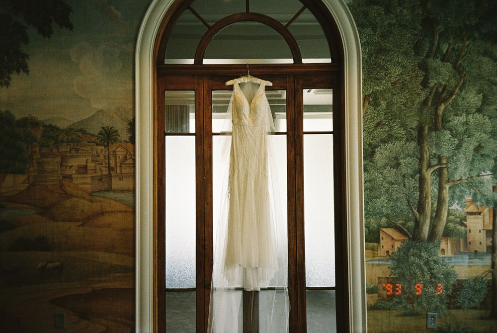 wedding-dress-hanging-in-the-faulker-jackson-ms-on-film