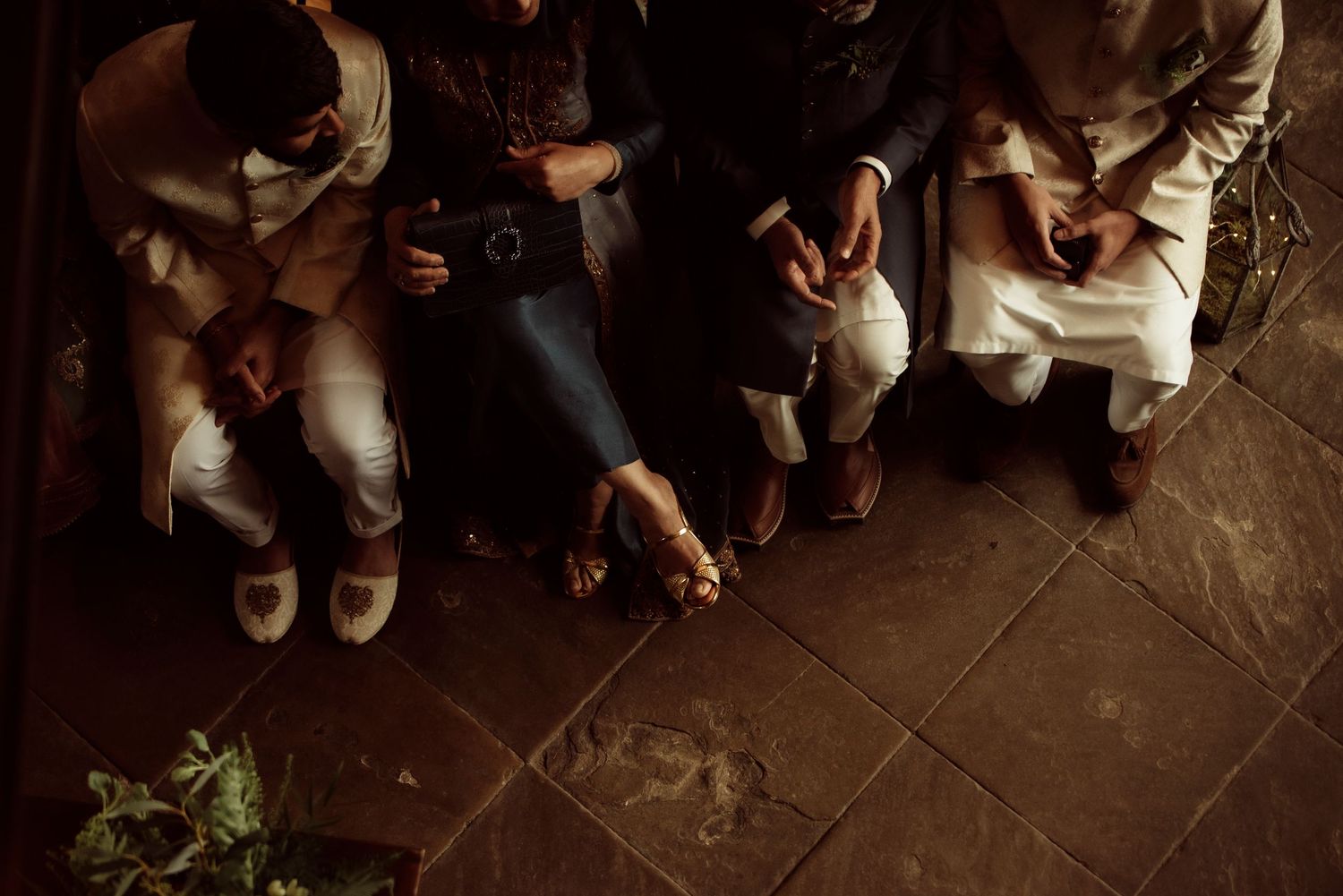 top down image of a wedding ceremony, guests feet