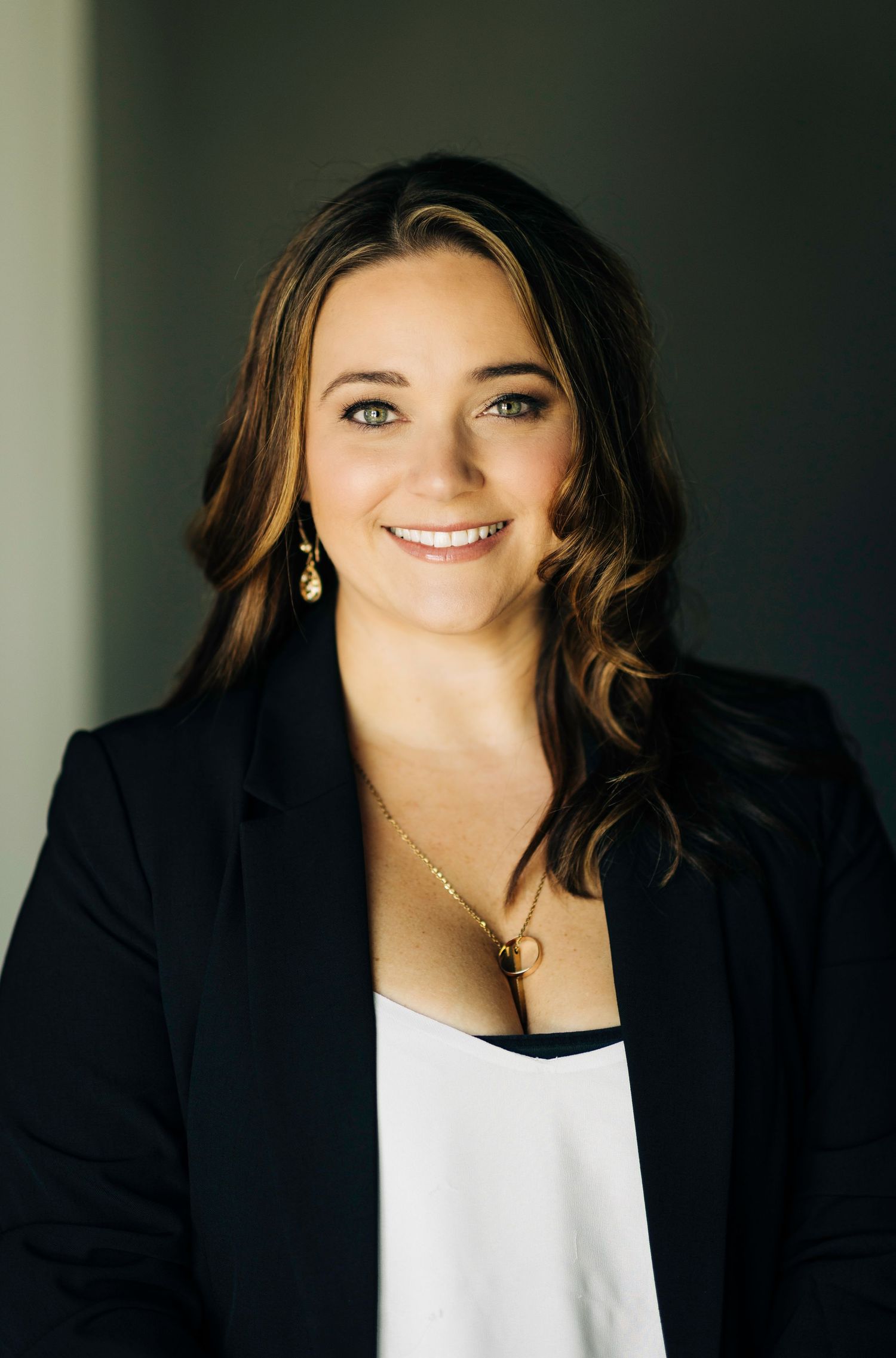 Sarasota, FL Real Estate Agent posing with her hair and makeup done in studio for her business headshots.