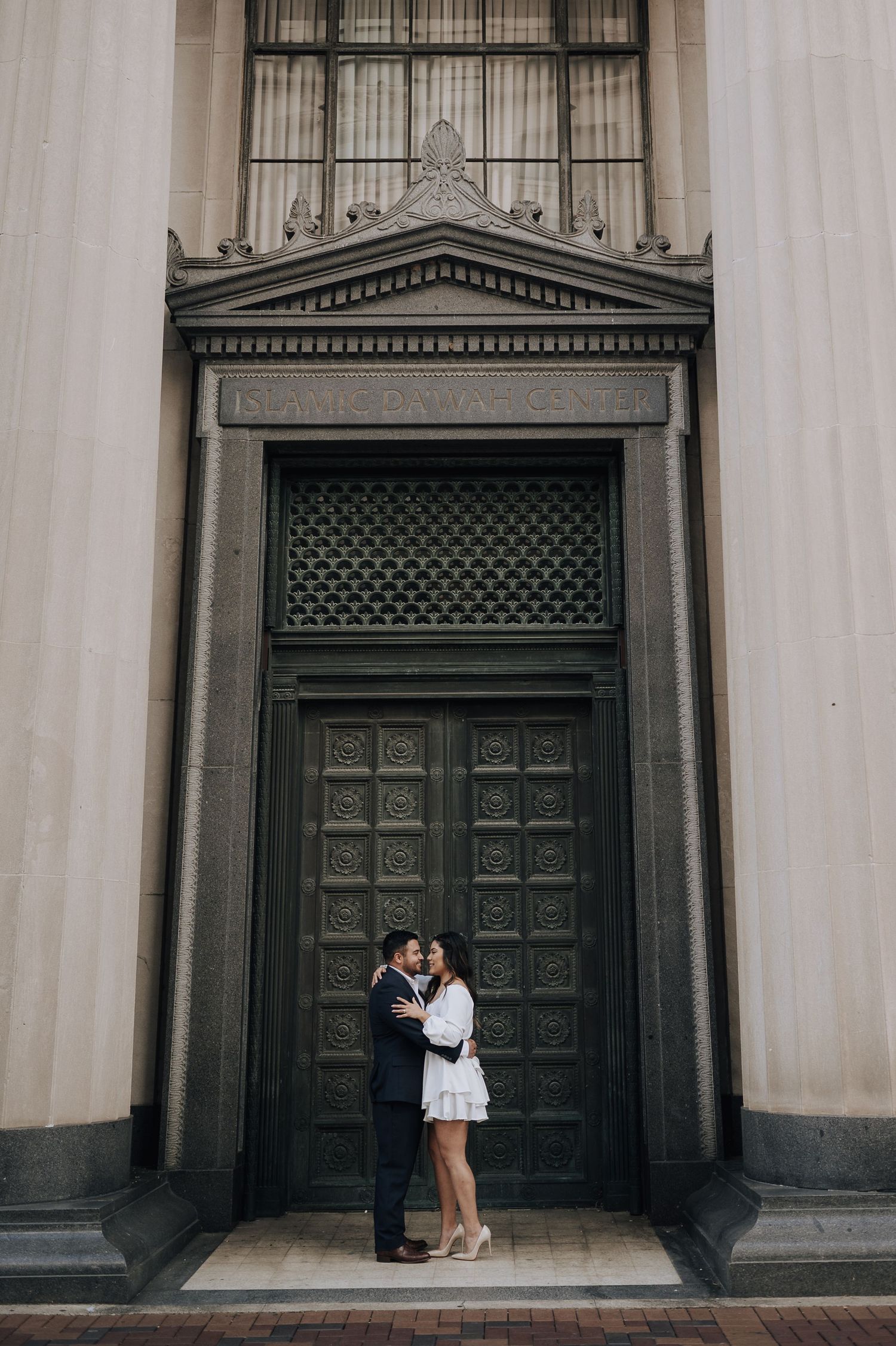 Houston area couple's engagement session. She is wearing white and red-bottom shoes.