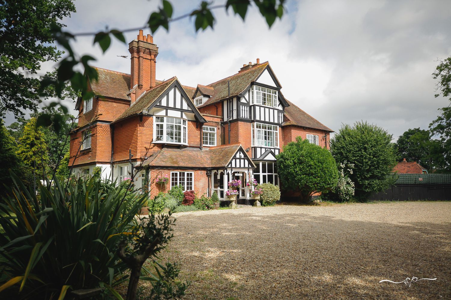 Wedding Venue Trunkwell House near Reading view from the front, summer time with cloudy sky.