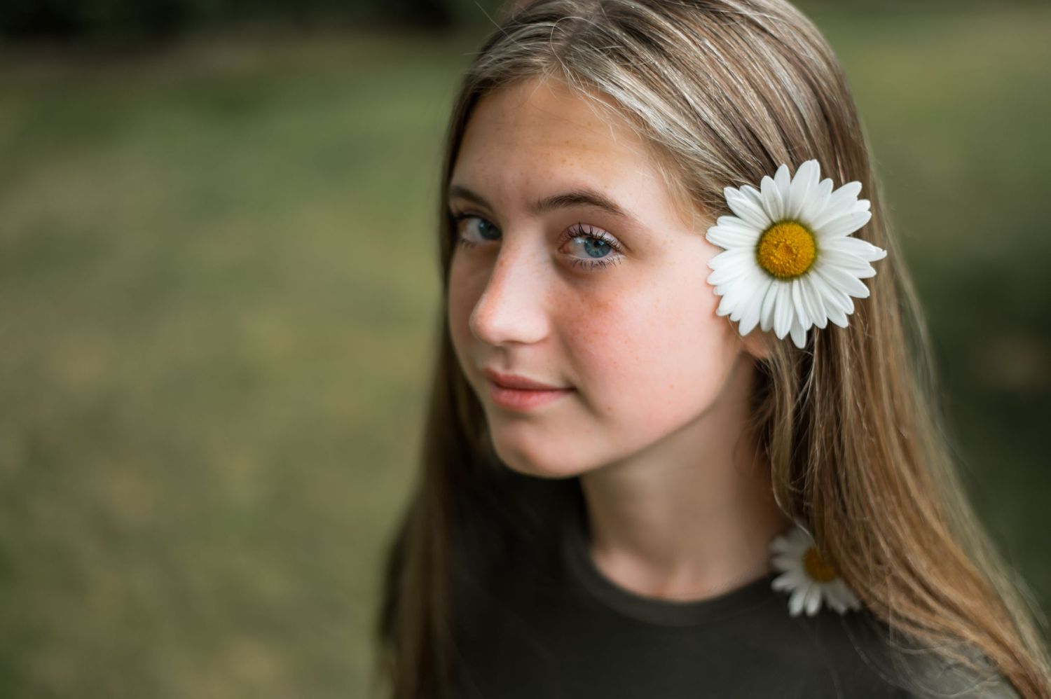 girl with flower outside for photo