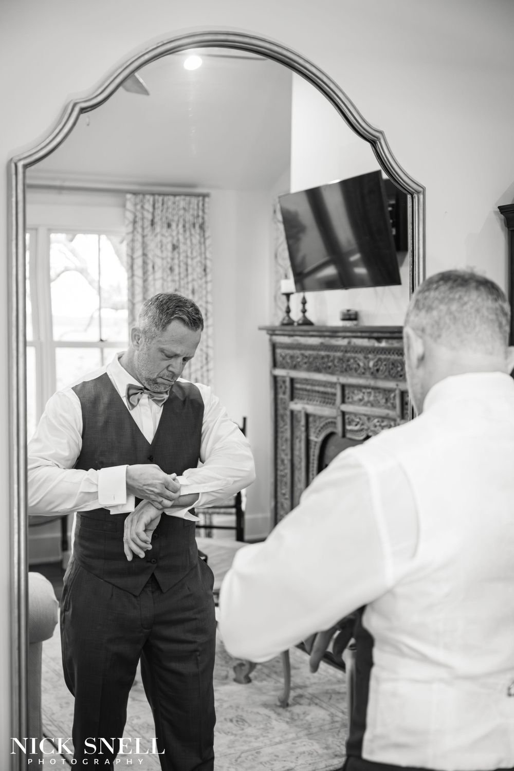 Black and white photos showing wedding preparation moments in an elegant indoor setting.