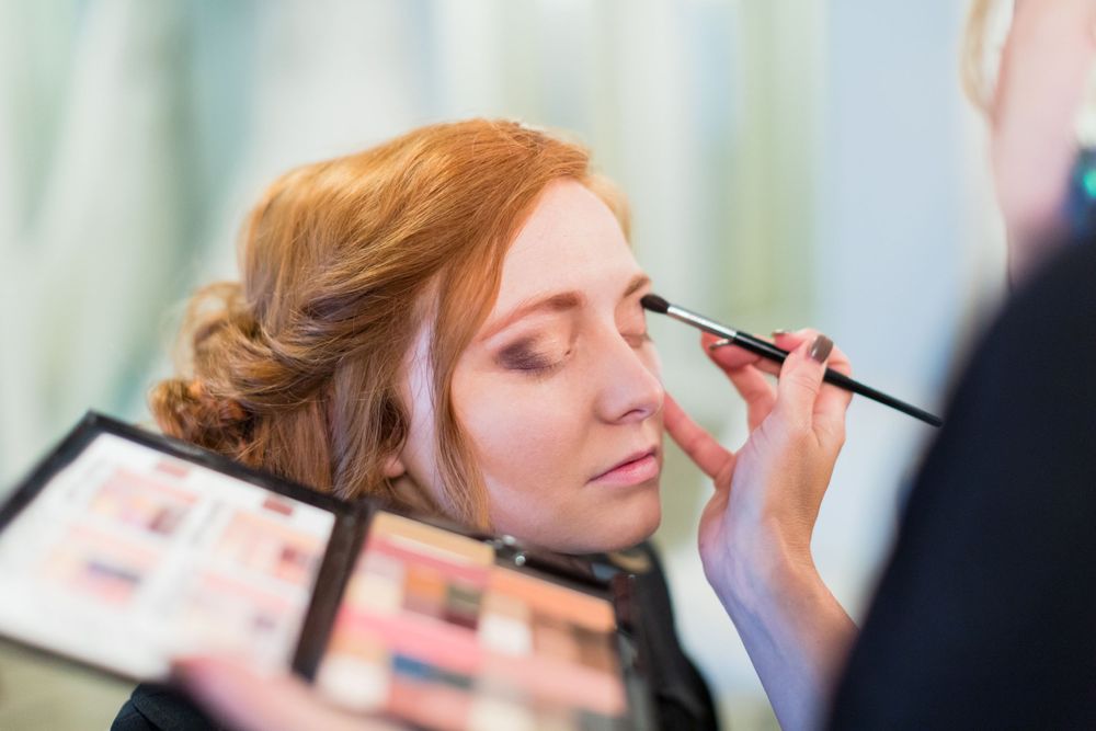 Professional makeup application focusing on eye makeup.