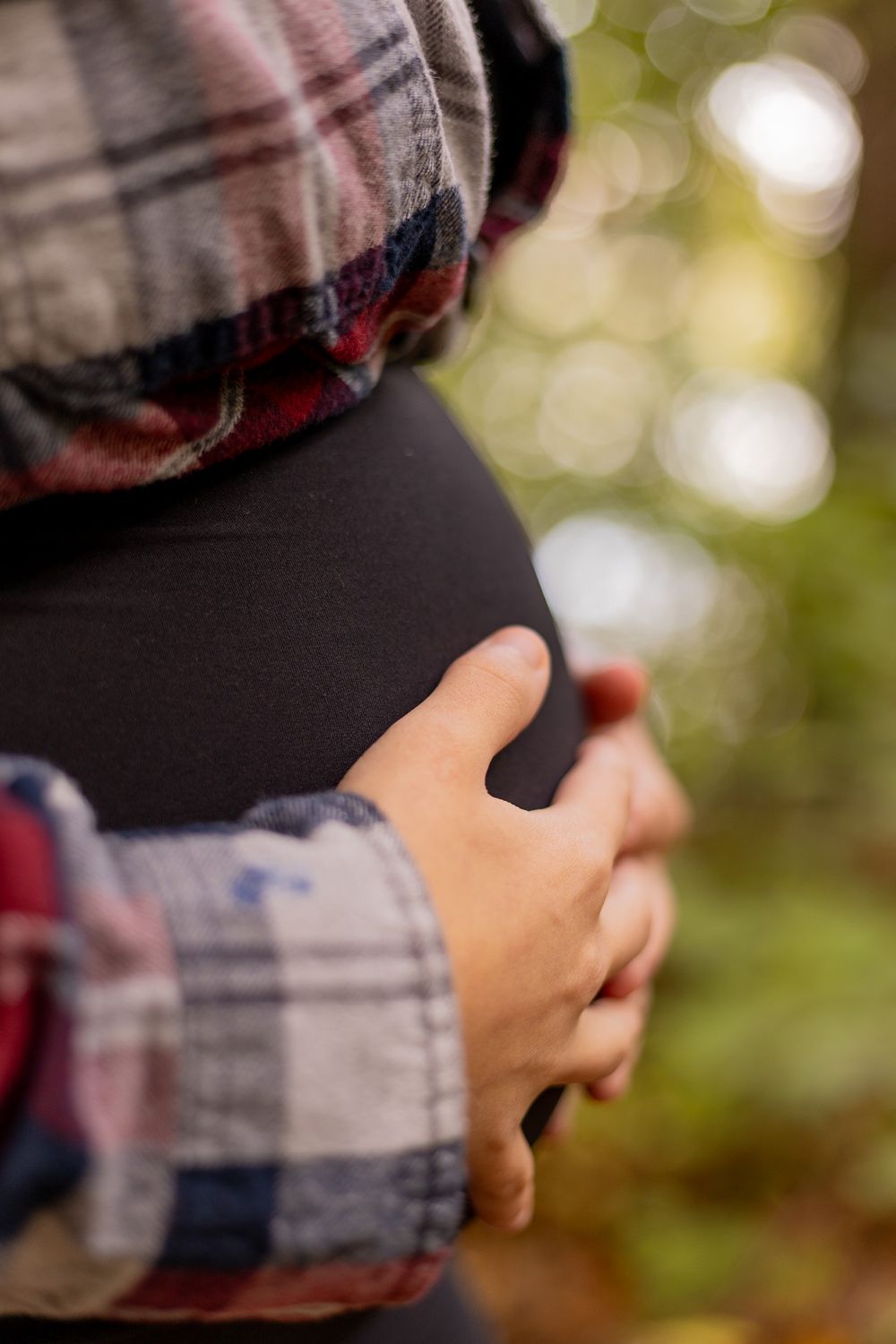 bump picture in woods maternity session