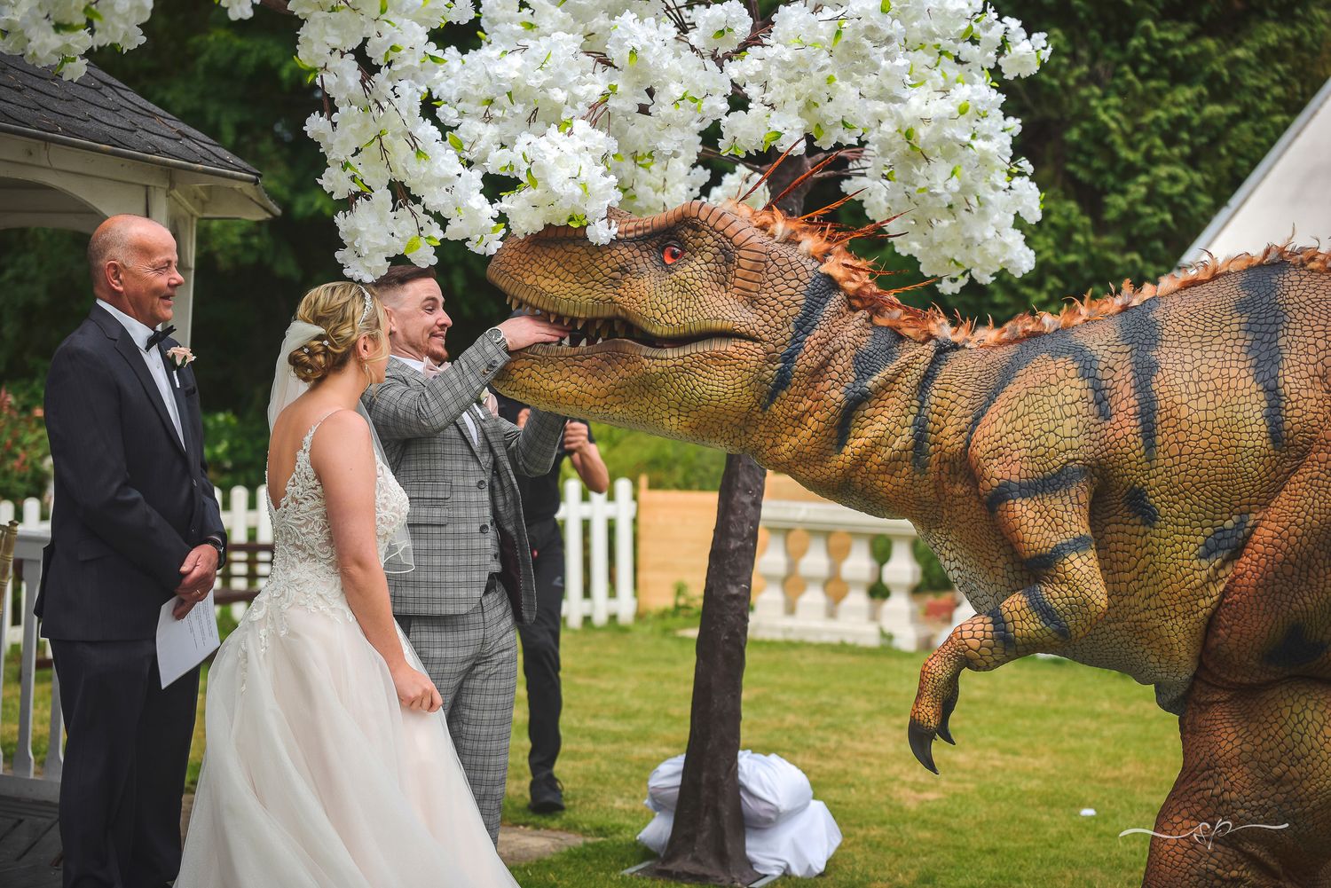 Dinosaur delivering the rings during the ceremony in Trunkwell House, wedding photographer.
