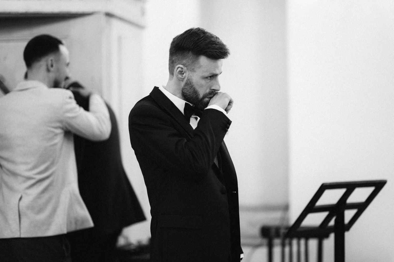 An emotional moment captured in black and white during wedding preparations.
