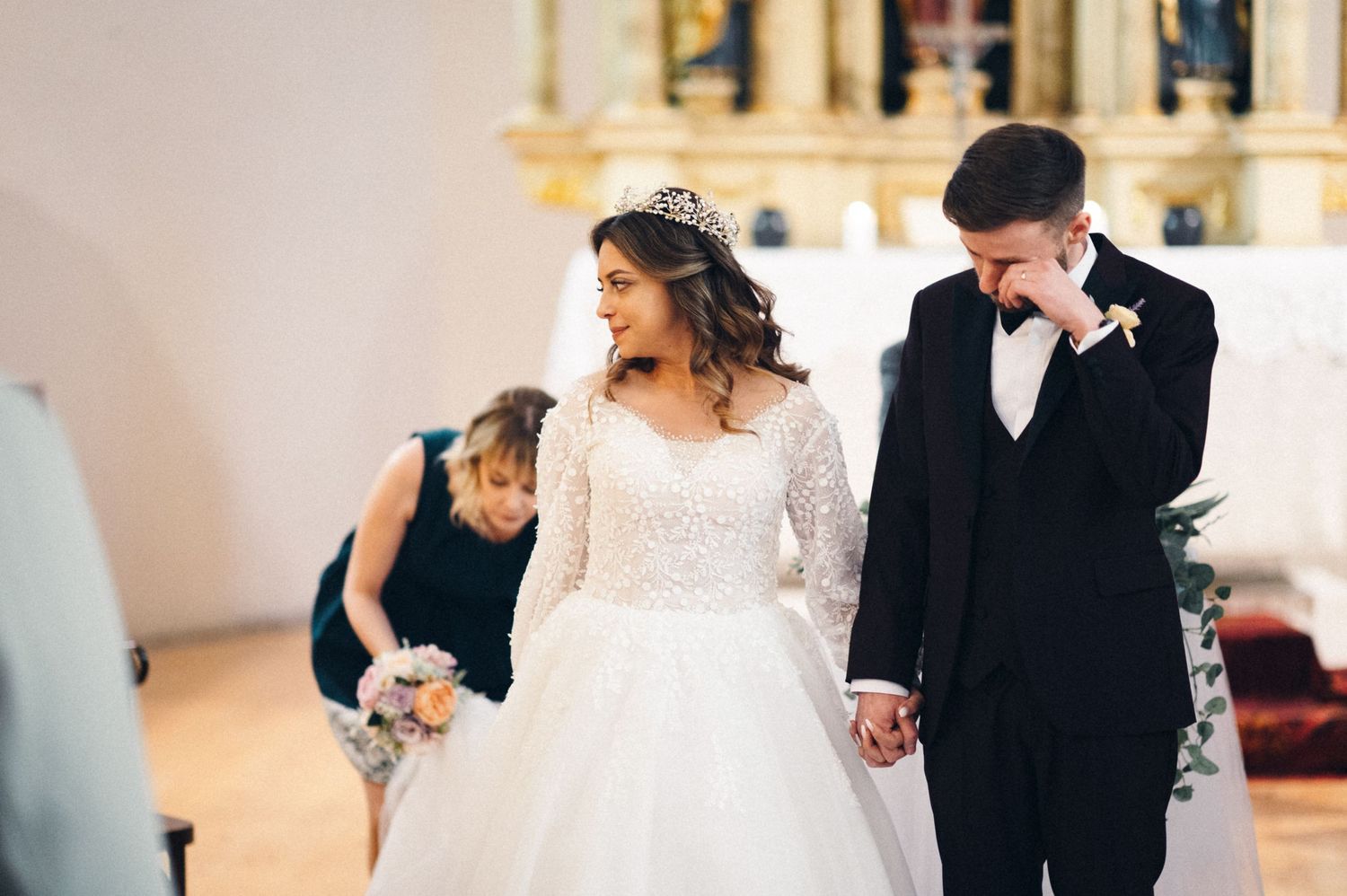 A couple shares an intimate moment during their church wedding ceremony.