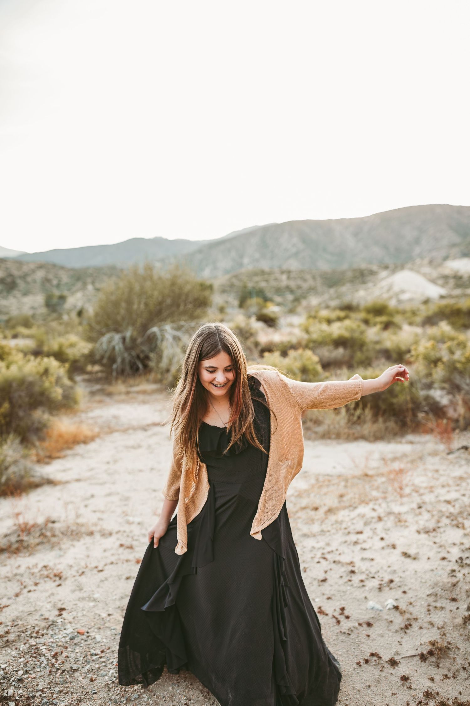 a teenage girl is dancing and holding her dress yucaipa ca
