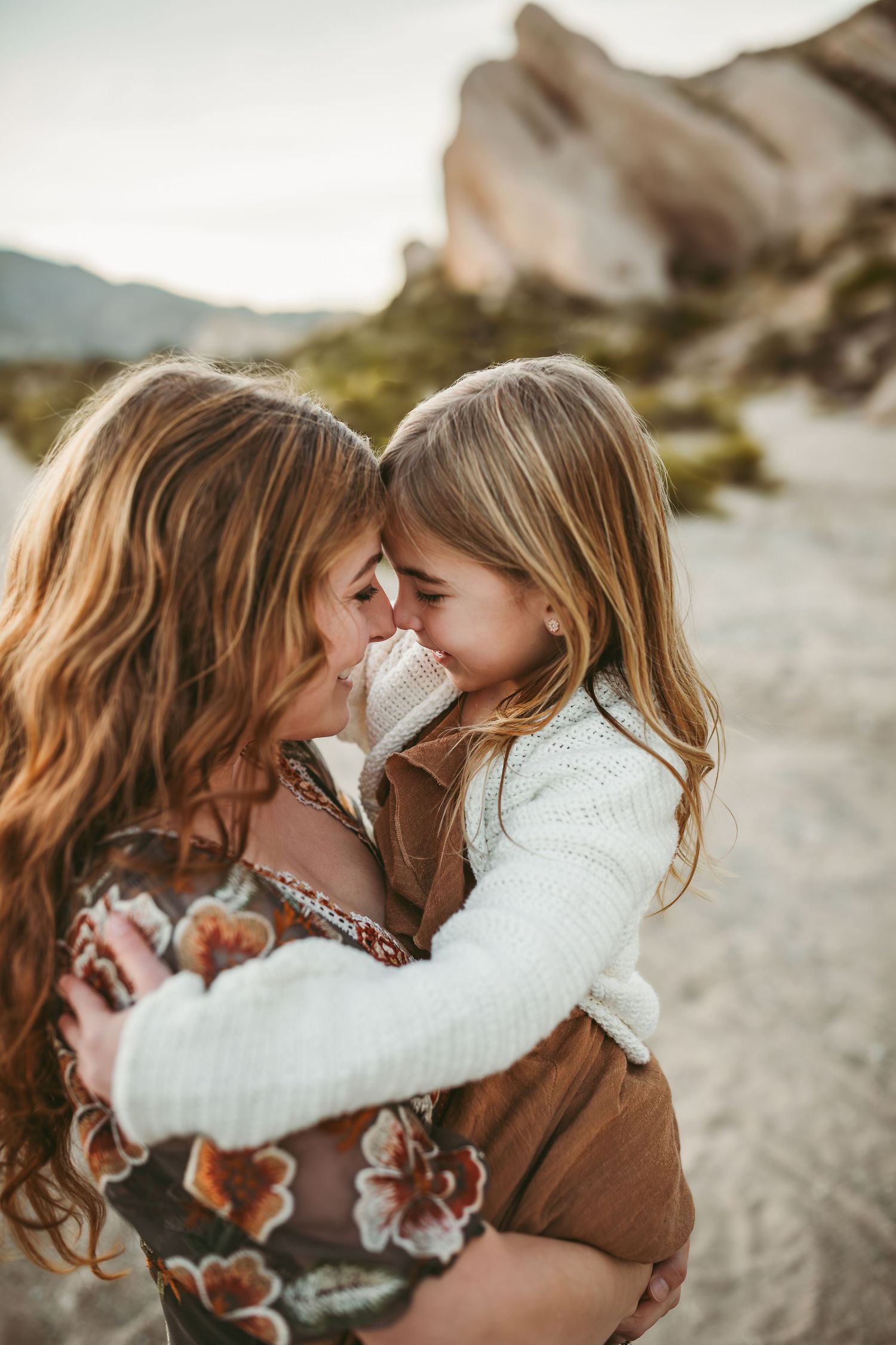 a close up photo of a mother and child embracing in yucaipa ca