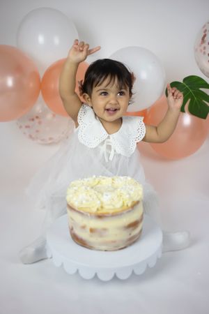 baby girl happy cake smash