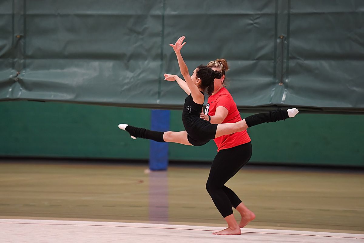 Ballet Teacher helping jump