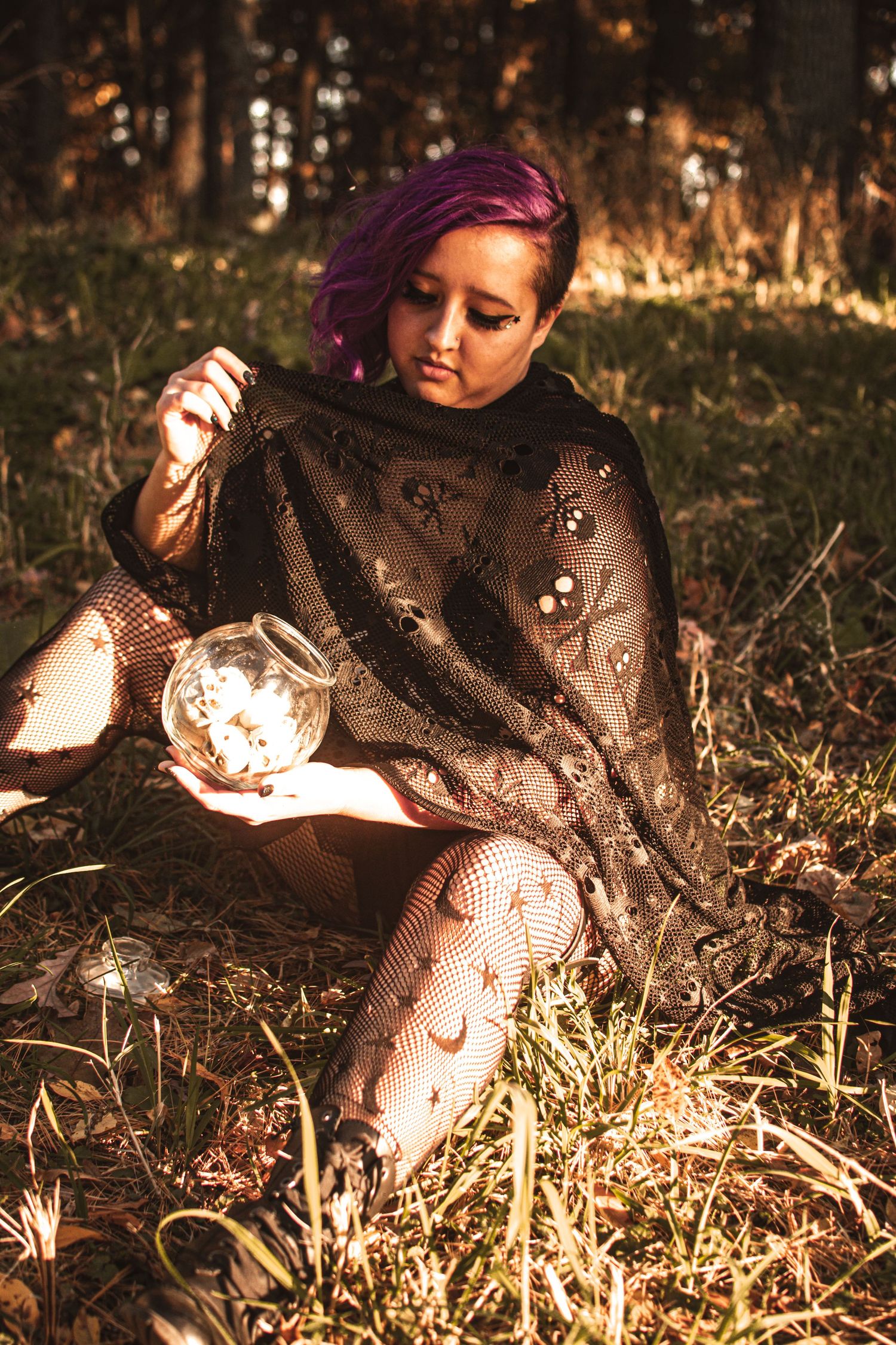 Gothic autumn portrait with lace dress and dramatic lighting.