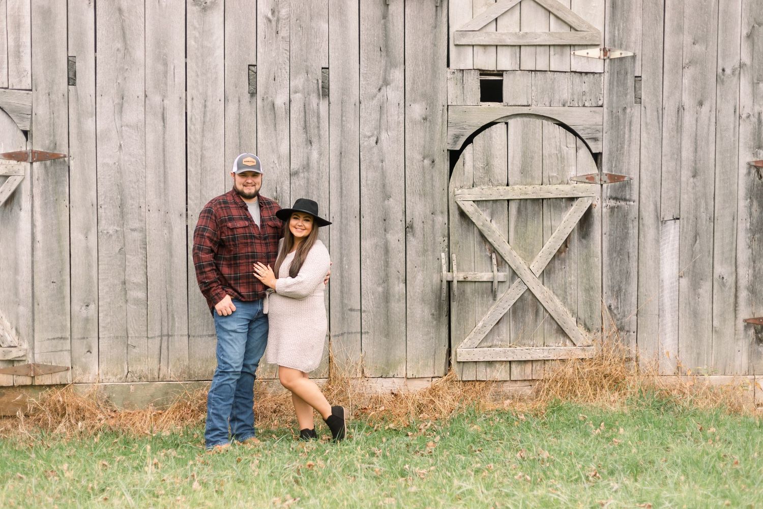 A series of romantic poses against a weathered wooden barn backdrop.
