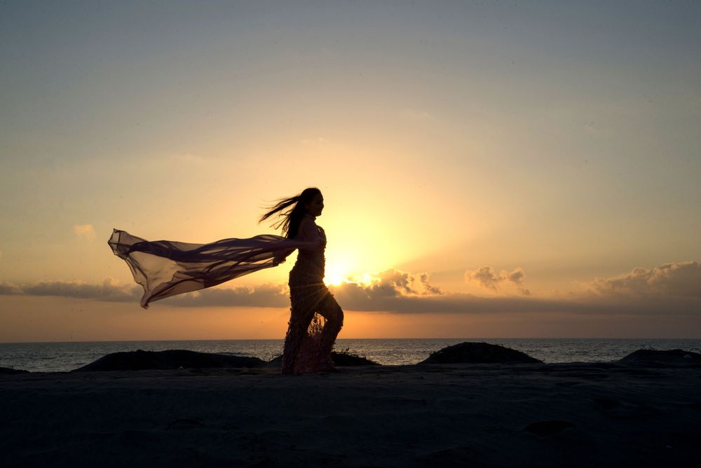 silhouette of a girl in front of the sun. girl posing in a boat enjoying the sun. South Padre Island. Quinceanera