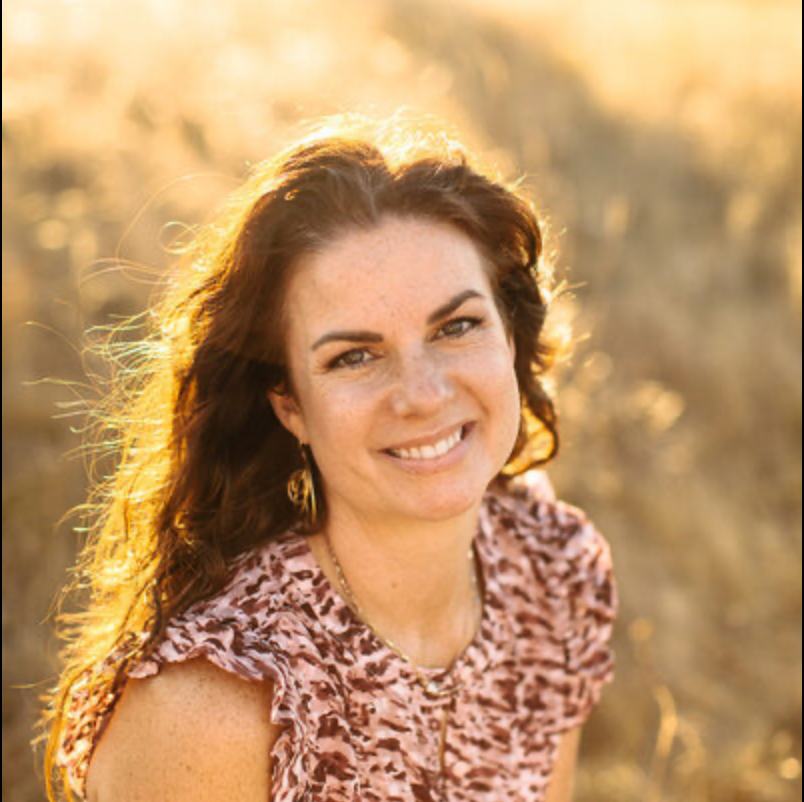 Golden hour portrait session in a natural outdoor setting with warm sunlight.