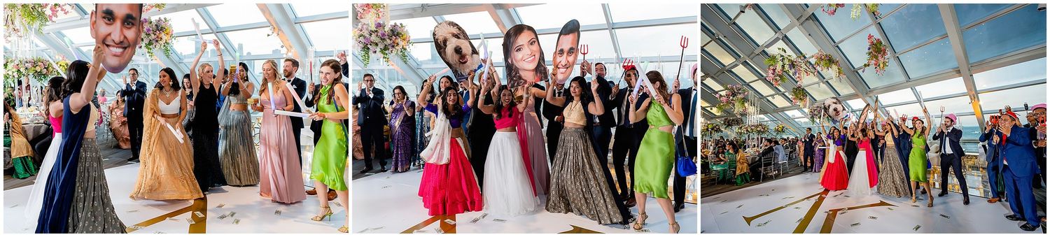 Formal event with dancing couples in colorful attire under a glass ceiling.