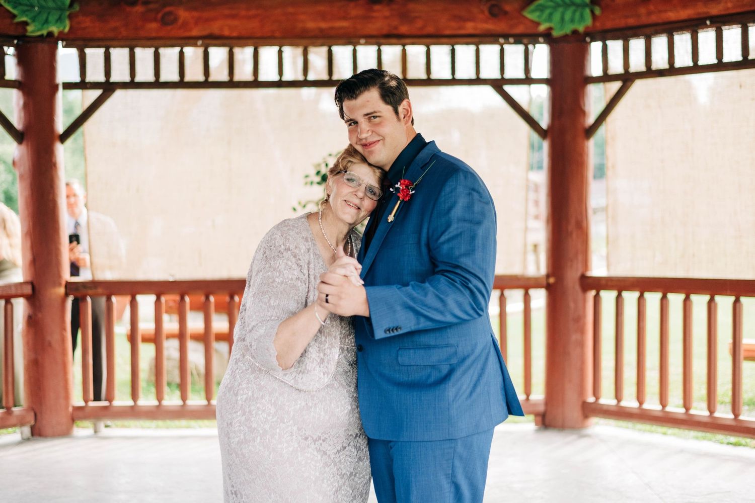 groom and mother dance at wedding reception