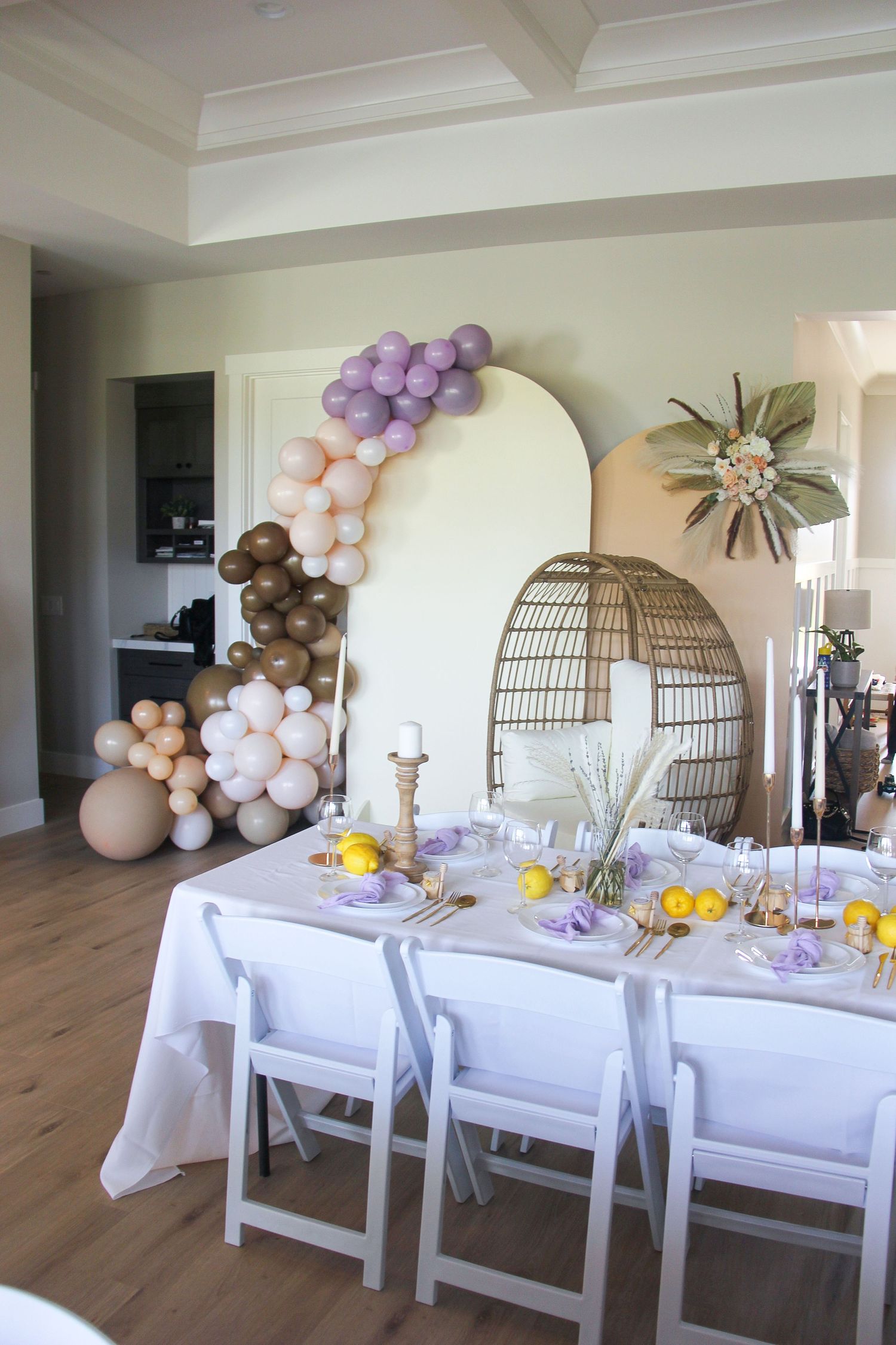 lilac baby shower table and balloon backdrop