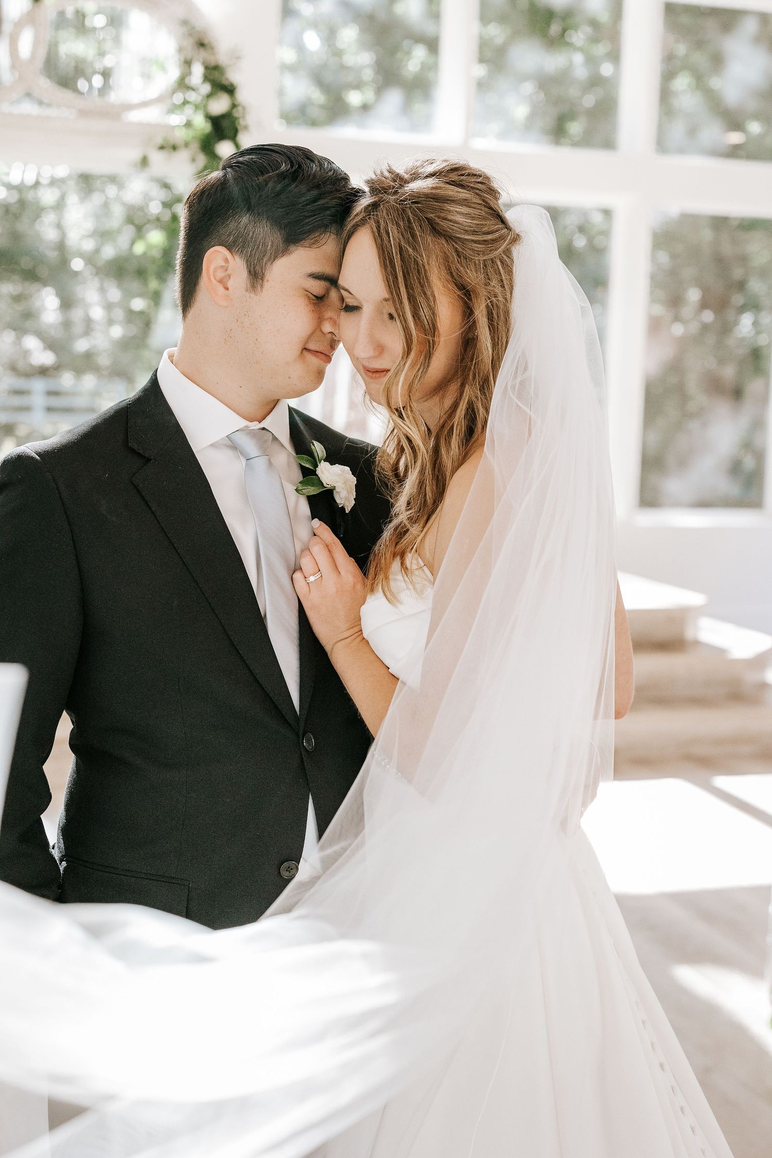 Bride and groom veil shot