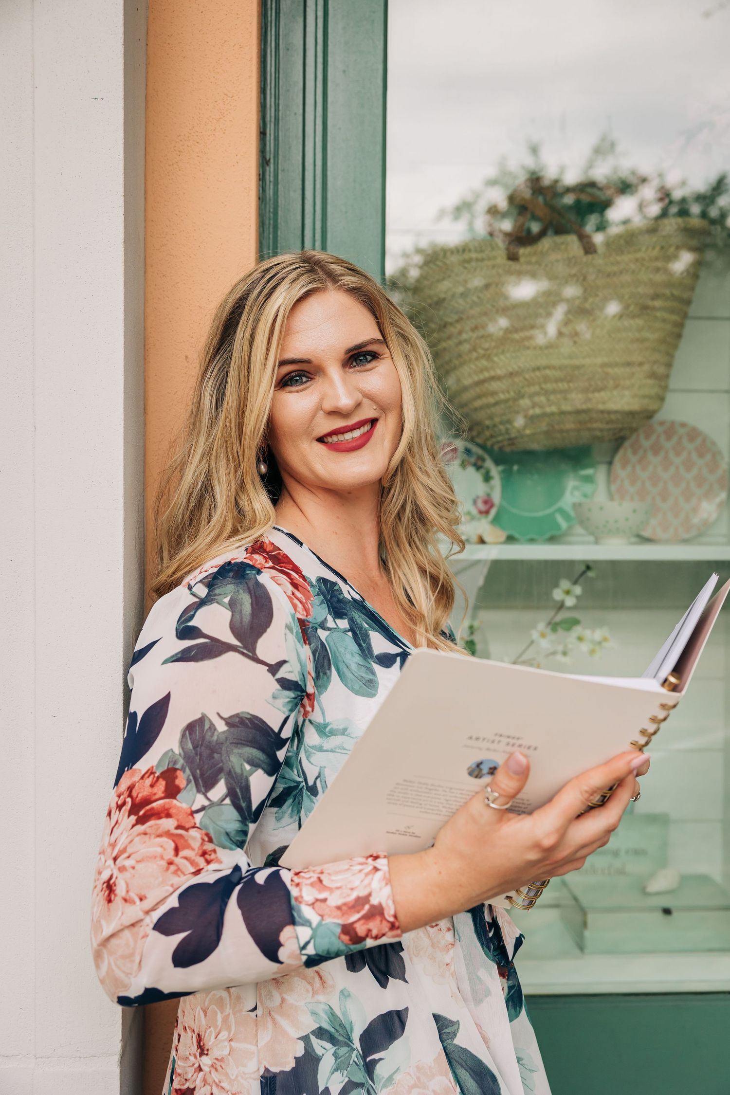Young women business owner holds her planner. Photographed by Sarasota photographer Samantha Brown Artistry.