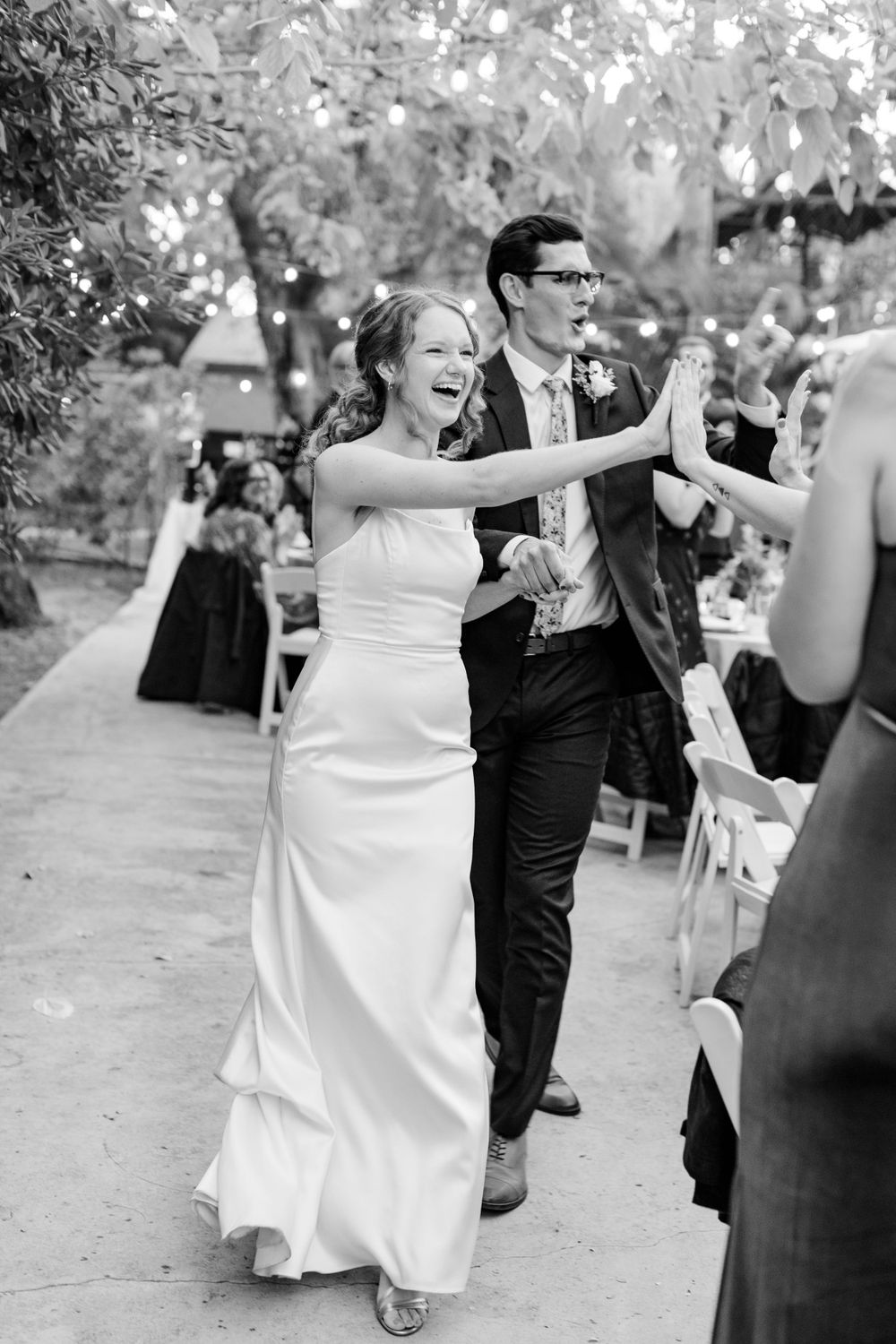 Reception entrance black and white bride smiling