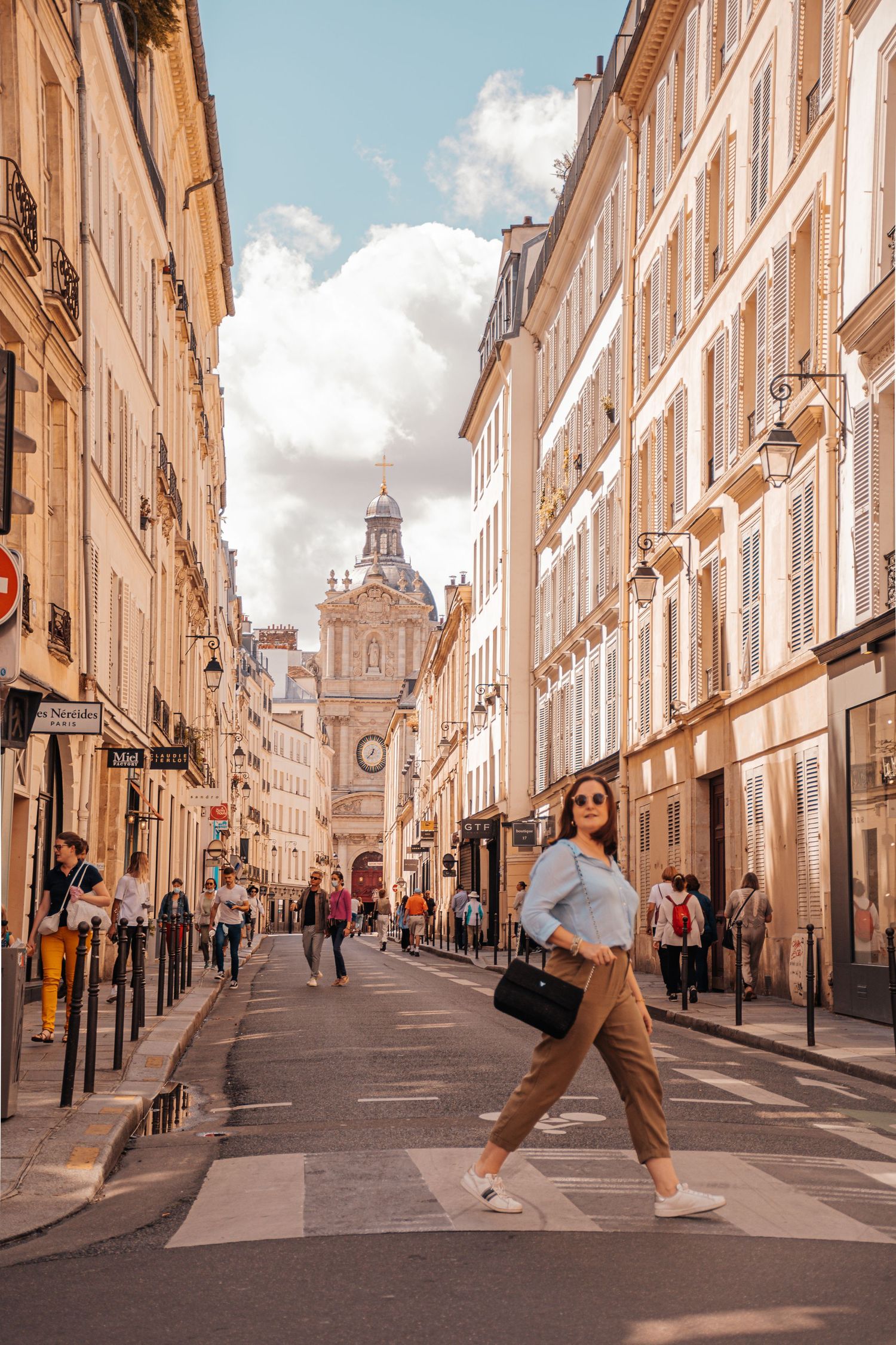 Young woman walking in a street in Paris.