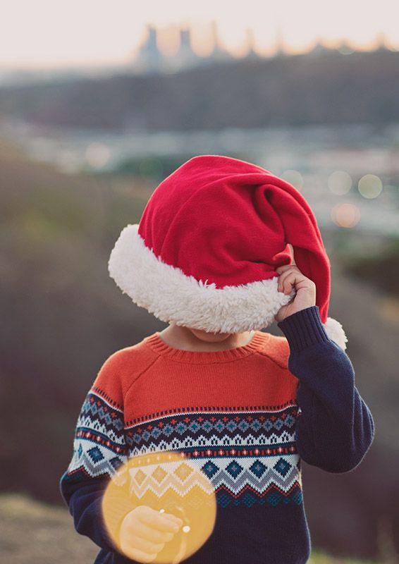 Christmas session, young child with Santa hat and the LA skyline in the background