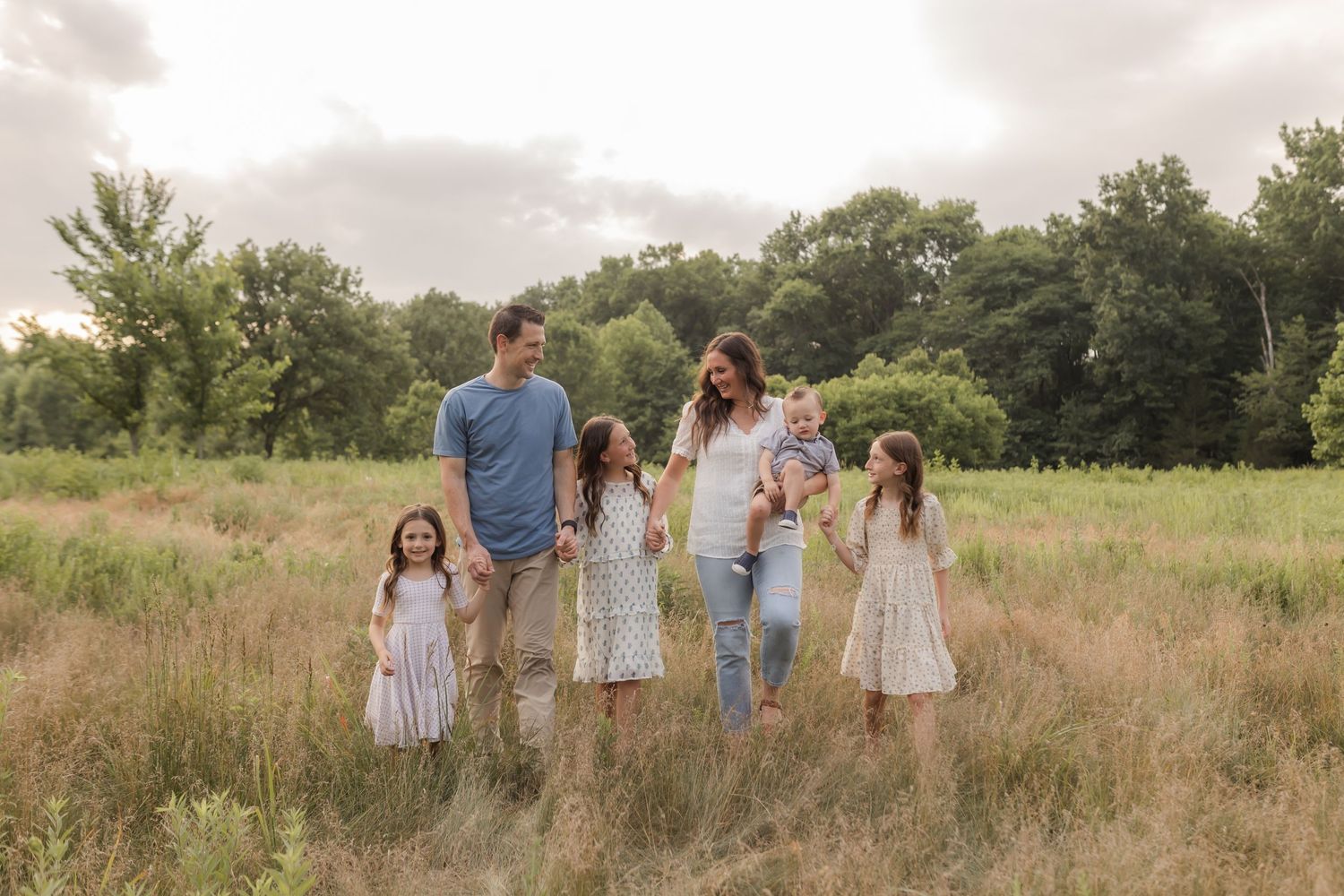Family photos in a field in Columbia Missouri photographer