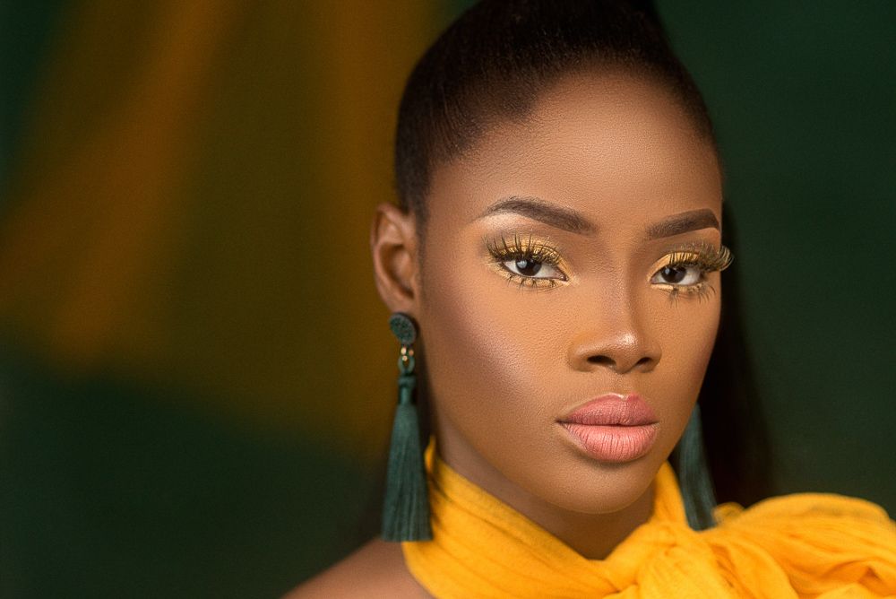 mustard and green beauty editorial themed photo, tassle earing